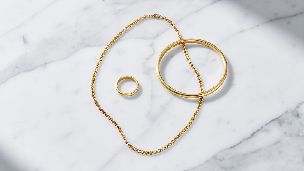 Solid 14K gold ring, necklace, and bracelet grouped together