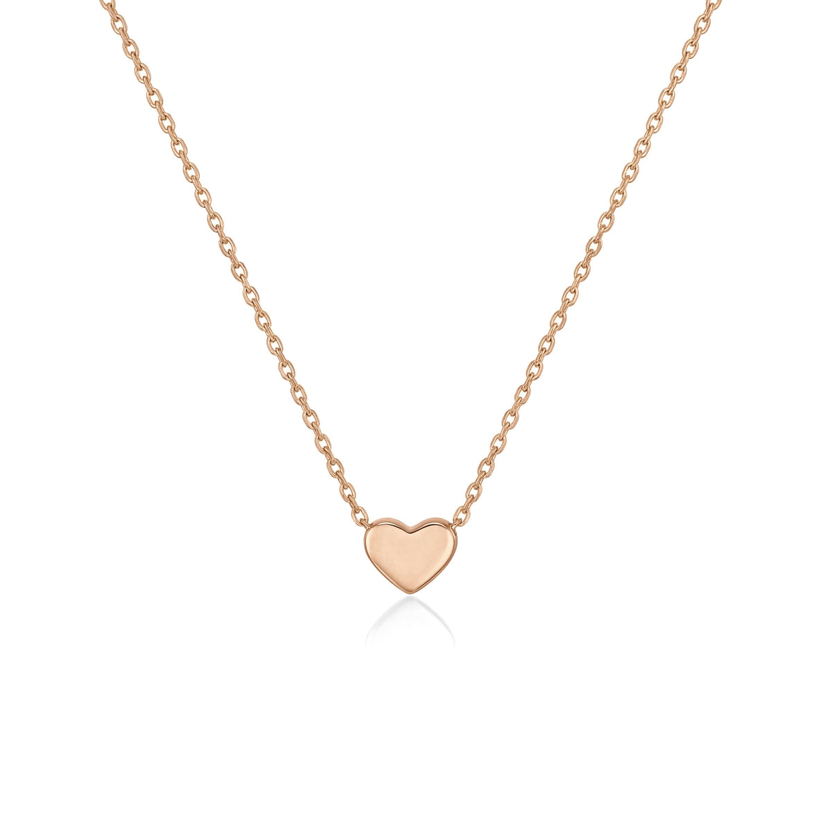 14K rose gold heart necklace, tiny polished heart fixed on a fine cable chain, close-up on white