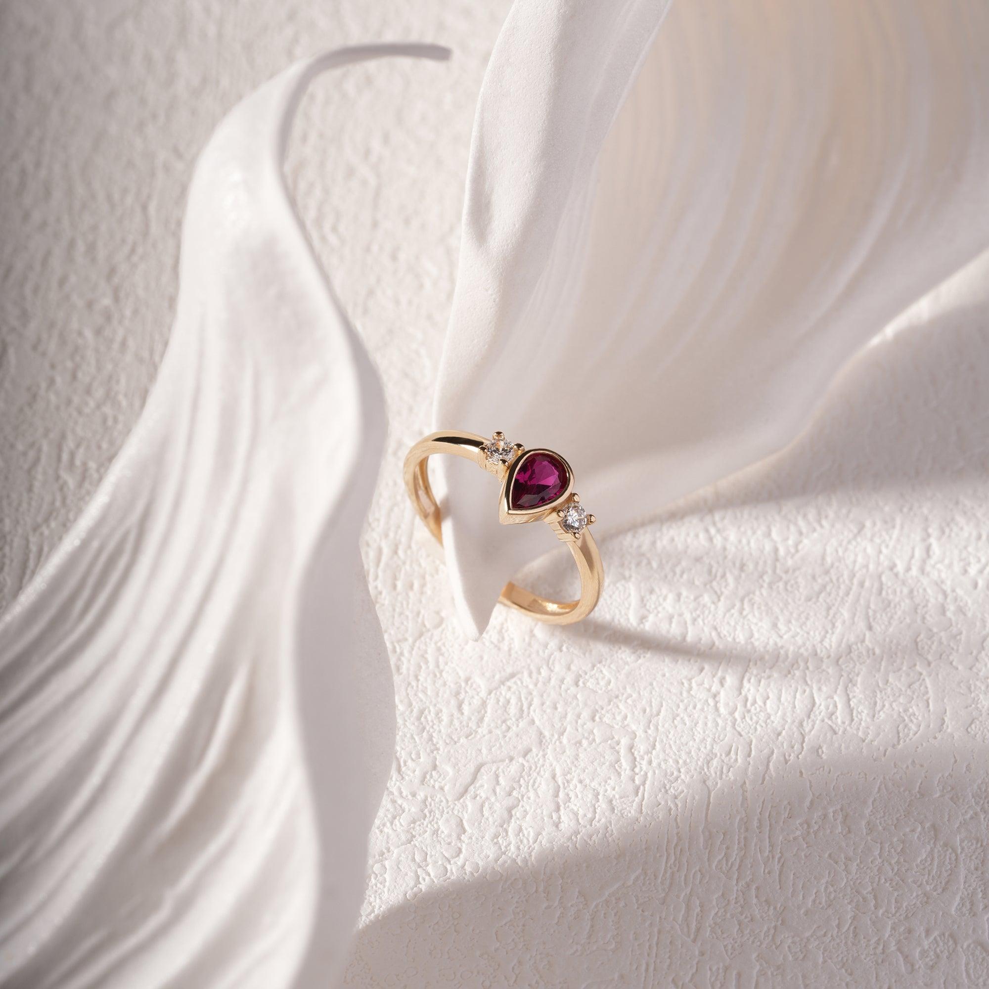 14K solid gold pear-cut ruby vintage ring with side zircon accents, product photo