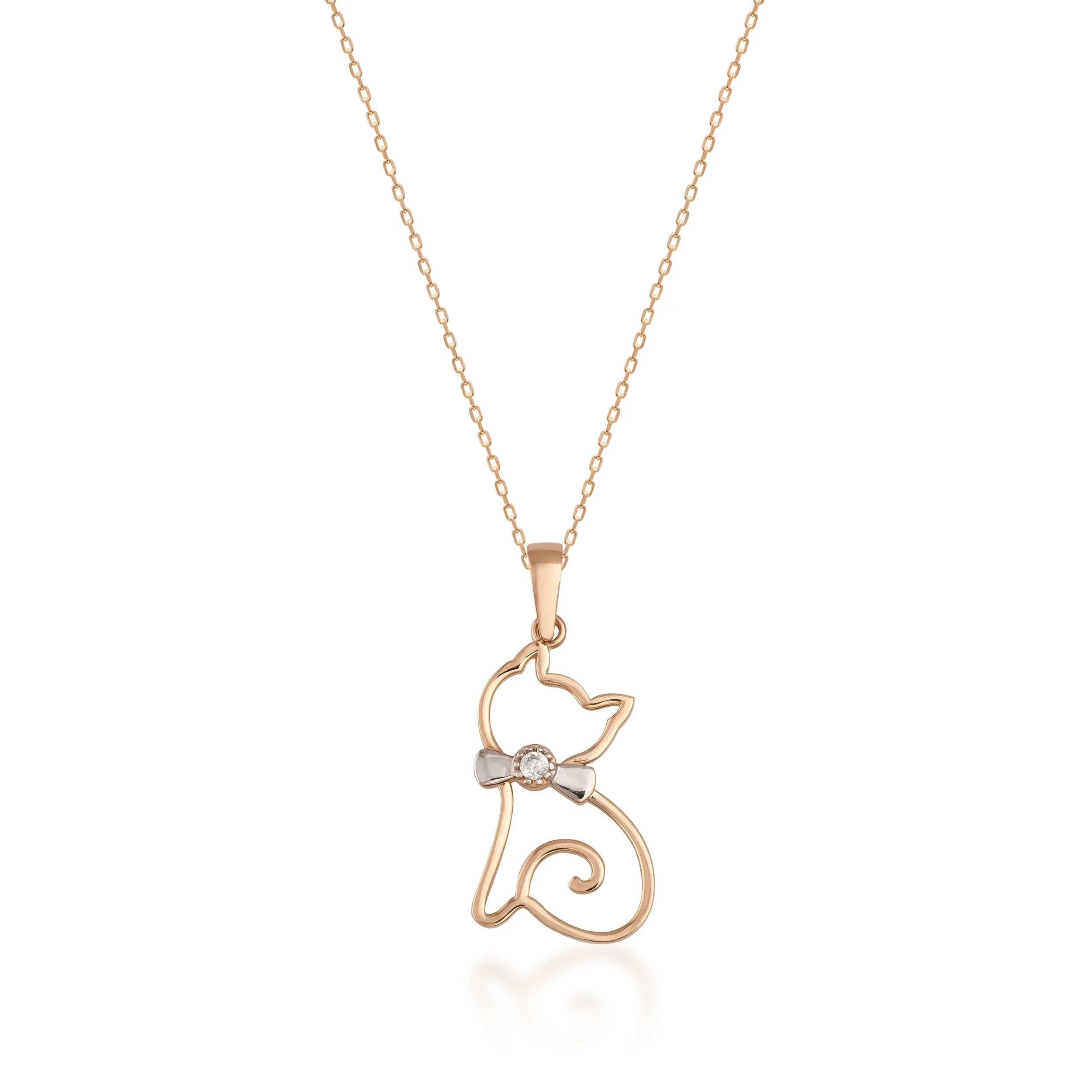 Gold cat pendant necklace with diamond accent and bow on a delicate chain