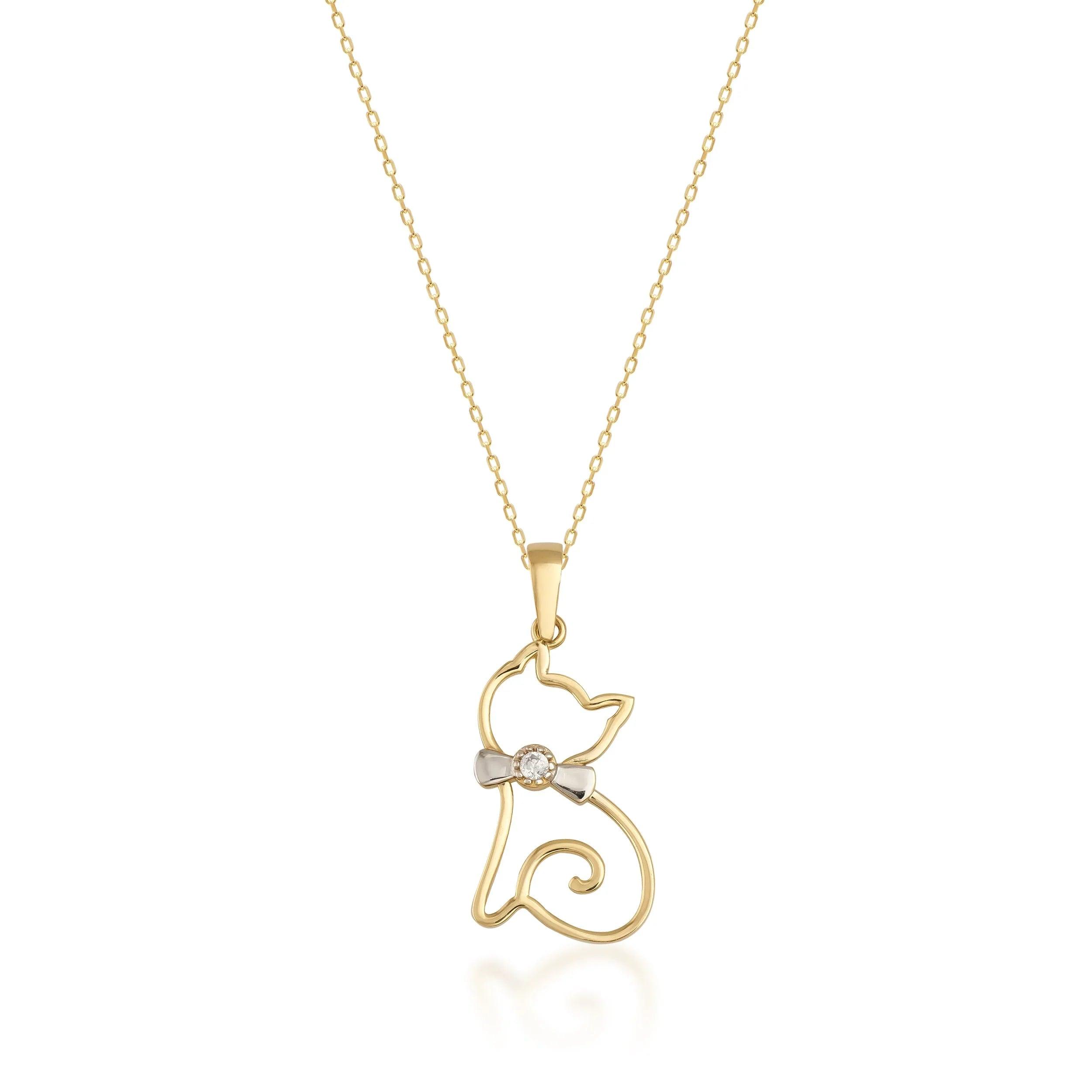 Gold cat outline pendant necklace with bow and diamond accent on white background