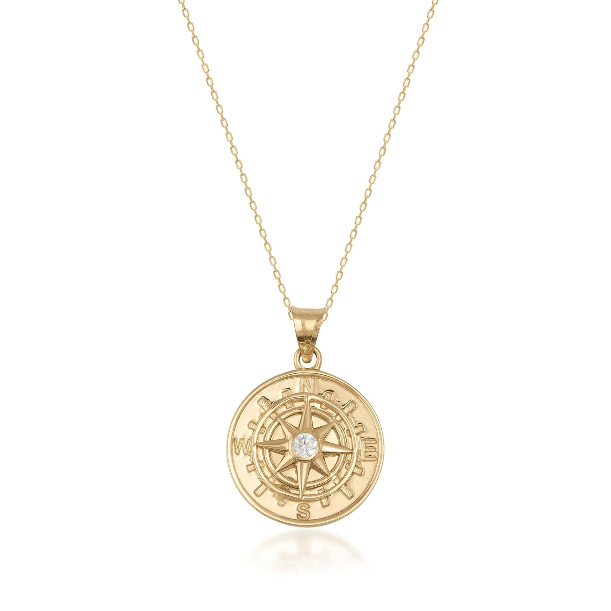 14K gold compass pendant necklace with a central cubic zirconia on a delicate gold chain, jewelry product photo