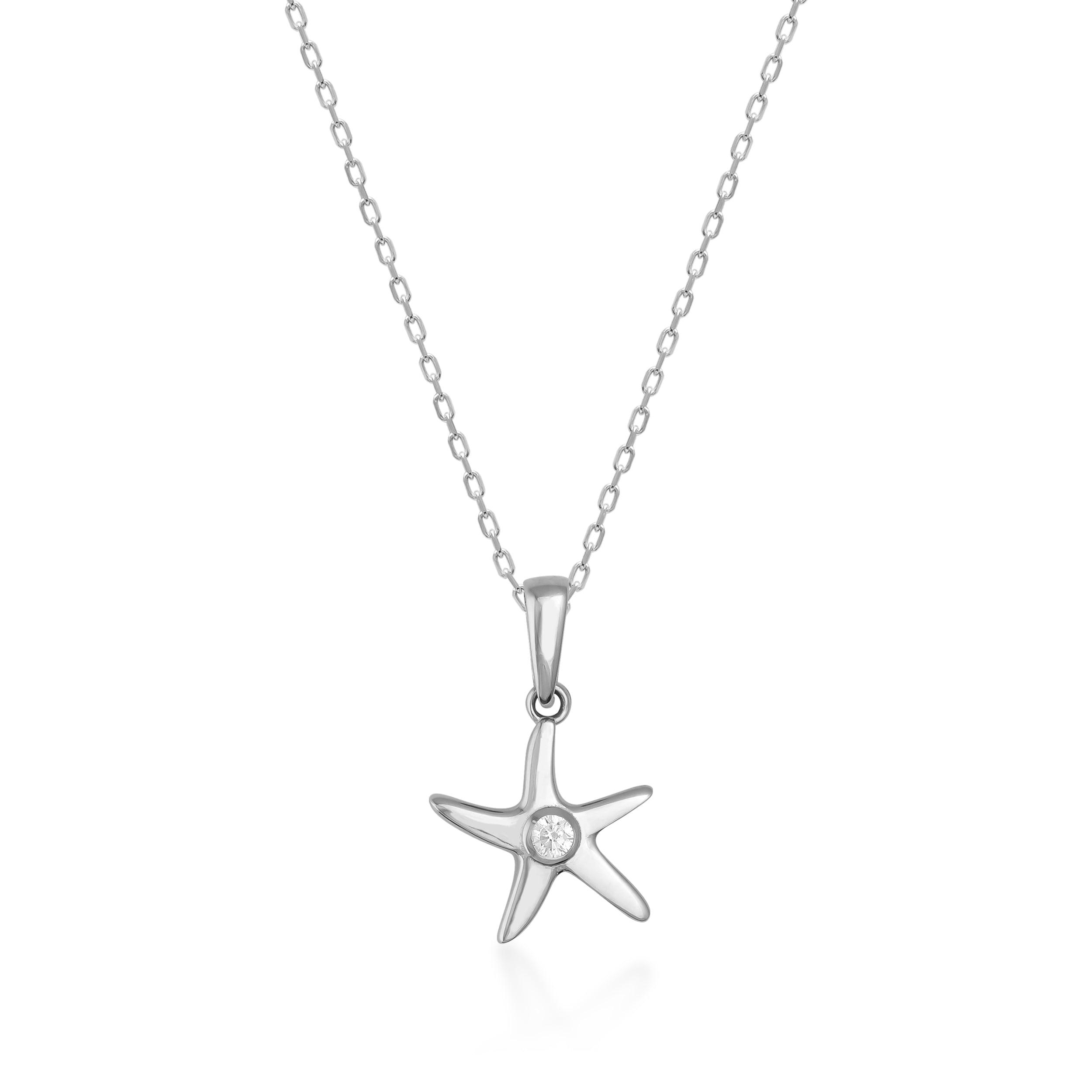 Sterling silver starfish pendant necklace with round clear gemstone on white background