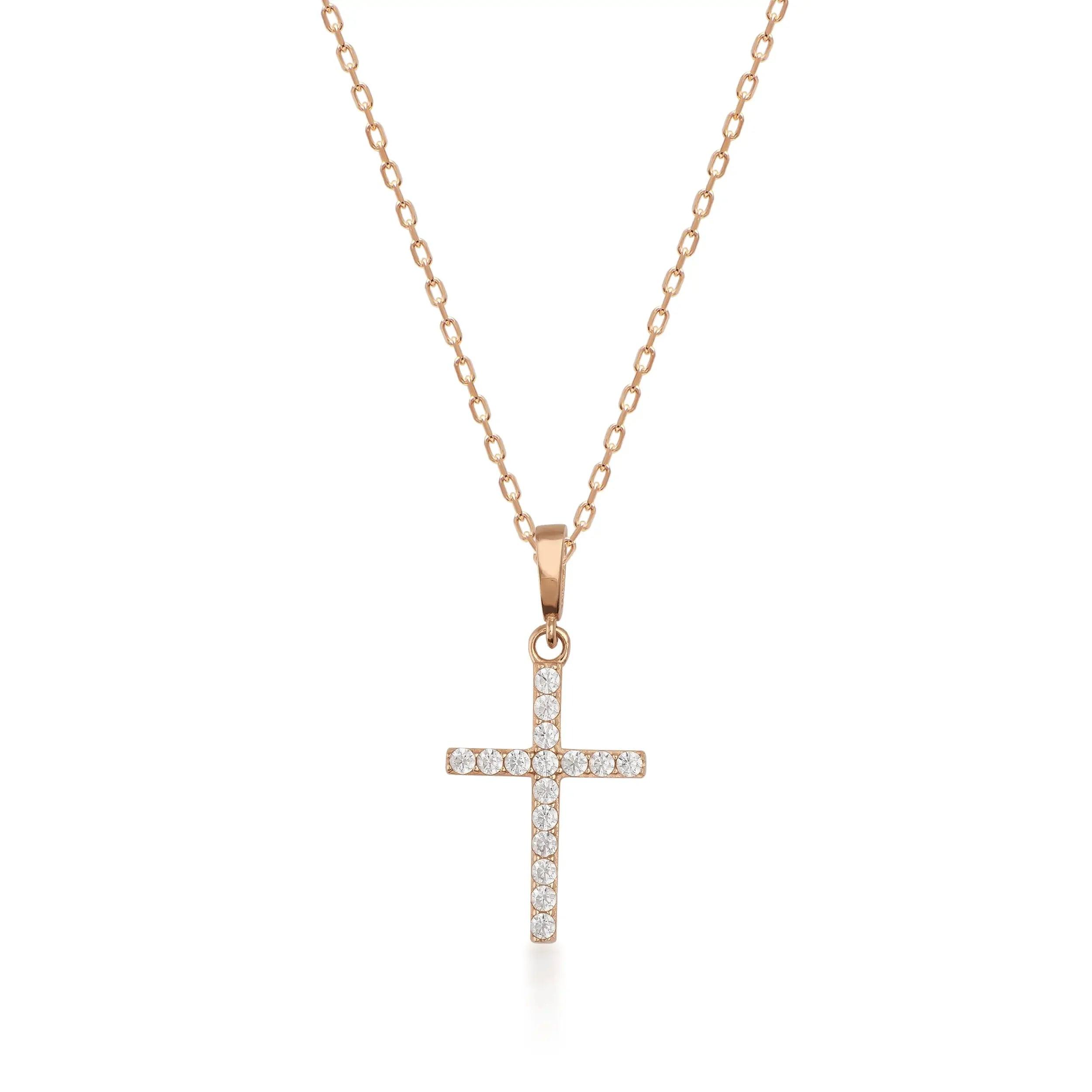 Gold chain necklace with a diamond cross pendant on a white background