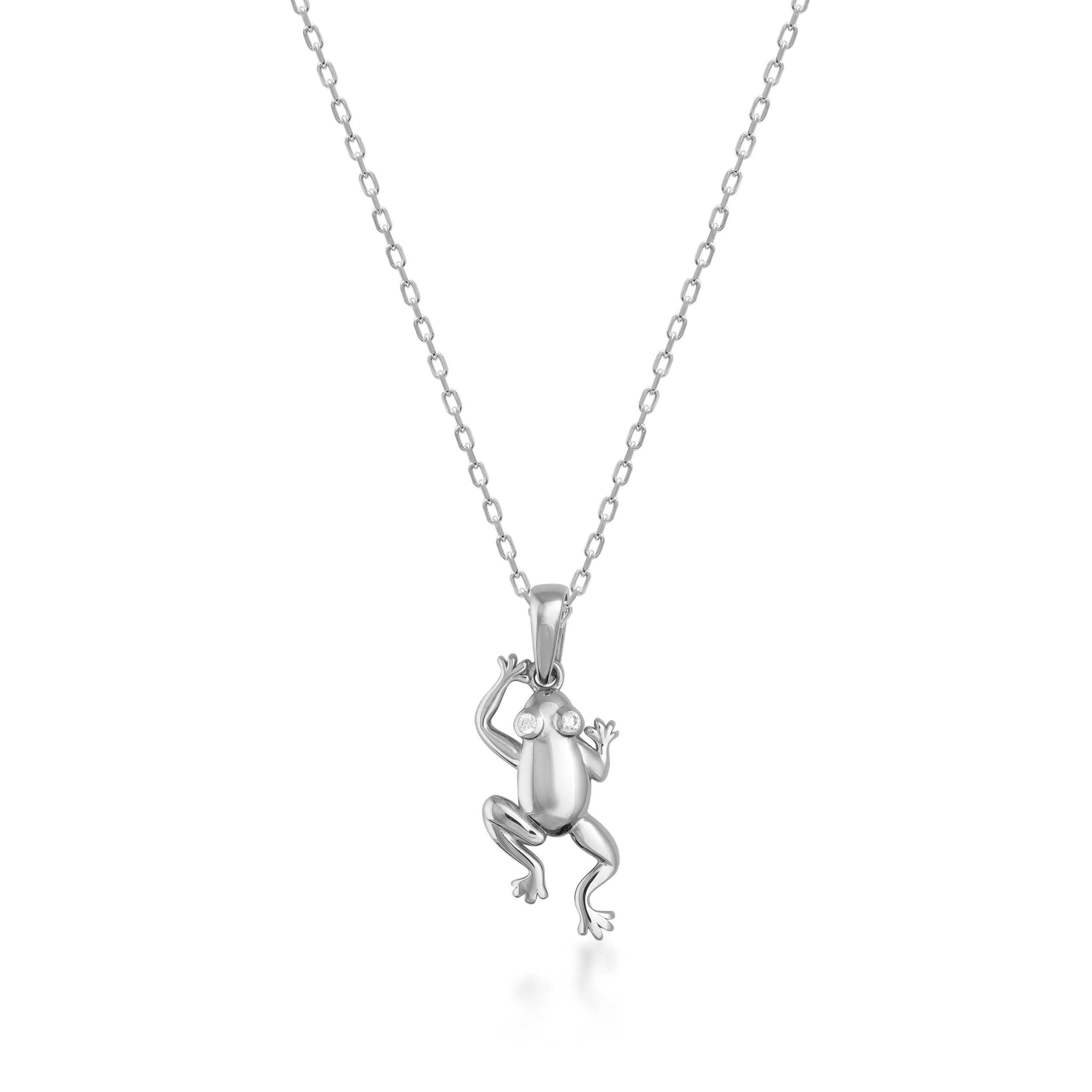 Gold frog pendant necklace with polished finish on a fine chain, minimalist jewelry design
