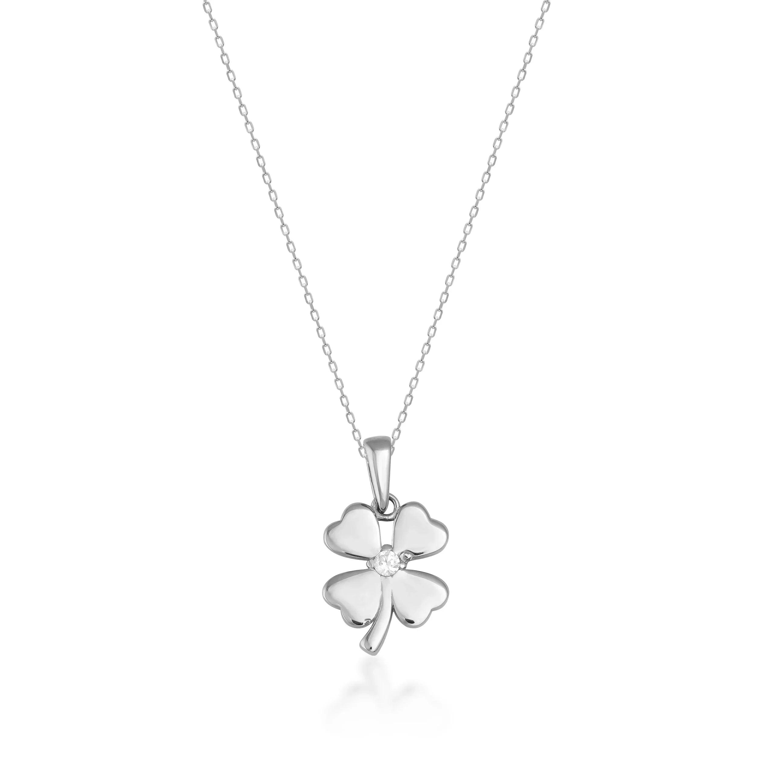 Gold four-leaf clover pendant necklace with a small gemstone on a delicate chain