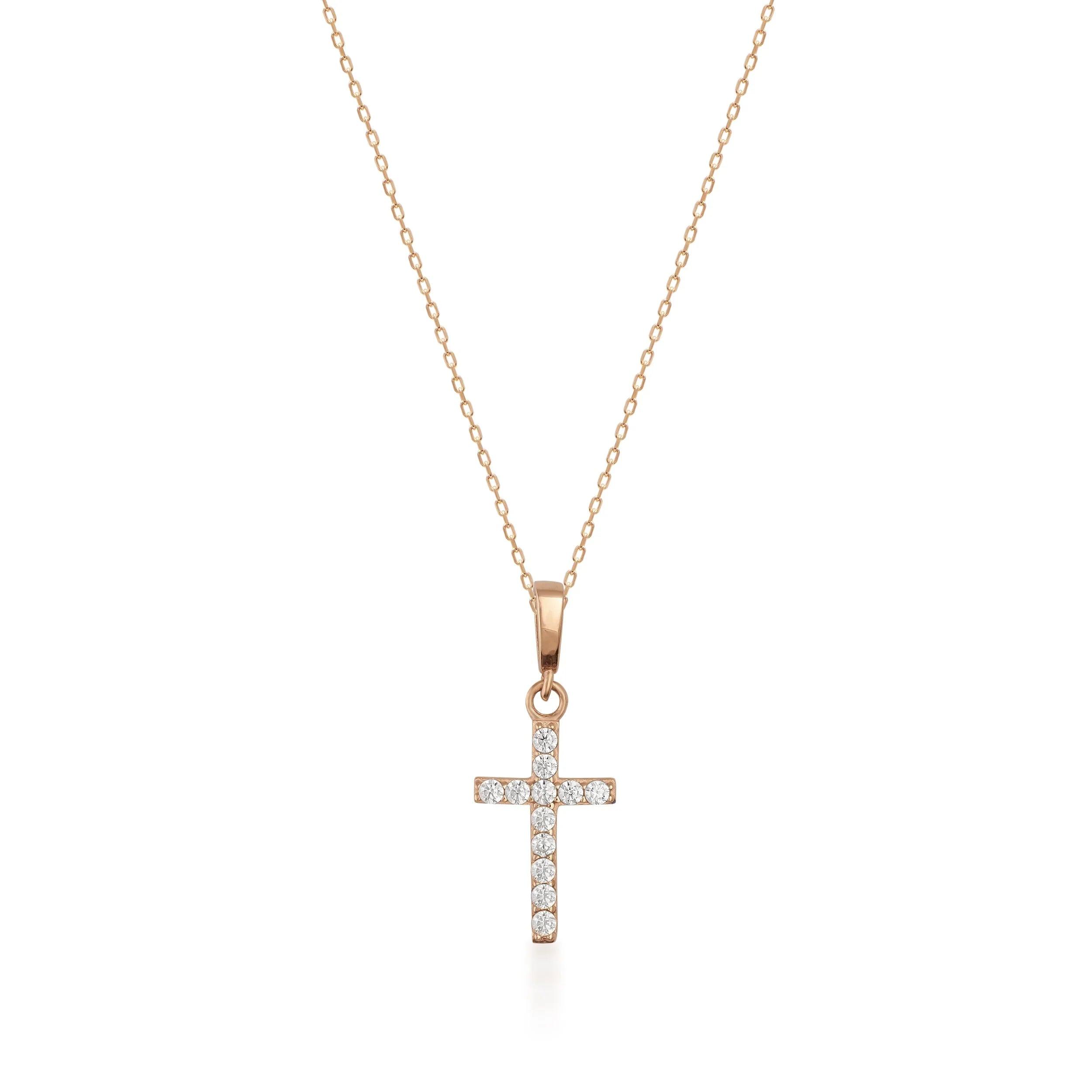 Gold chain necklace with diamond cross pendant on white background