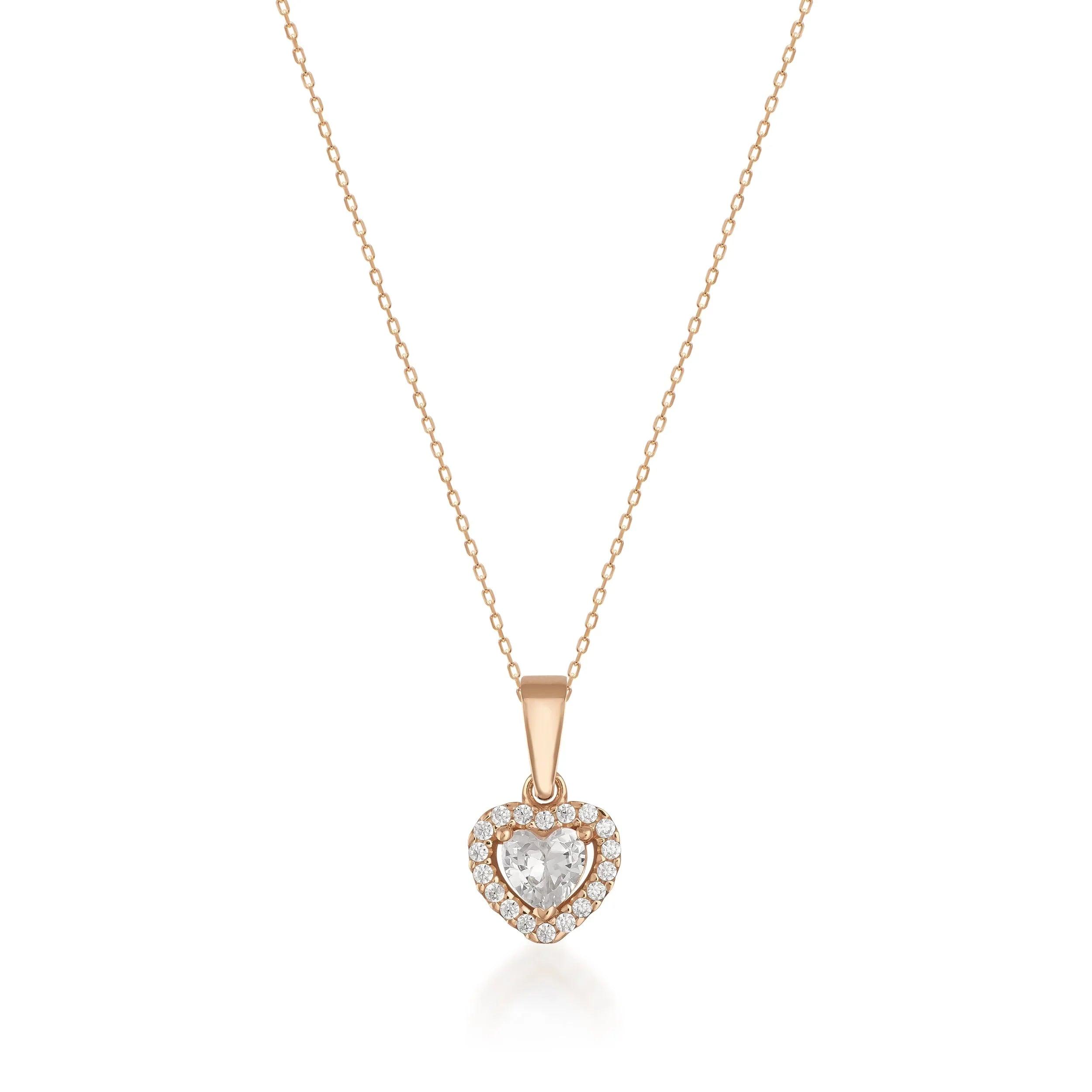 Gold necklace with a heart-shaped diamond and halo pendant on a fine chain
