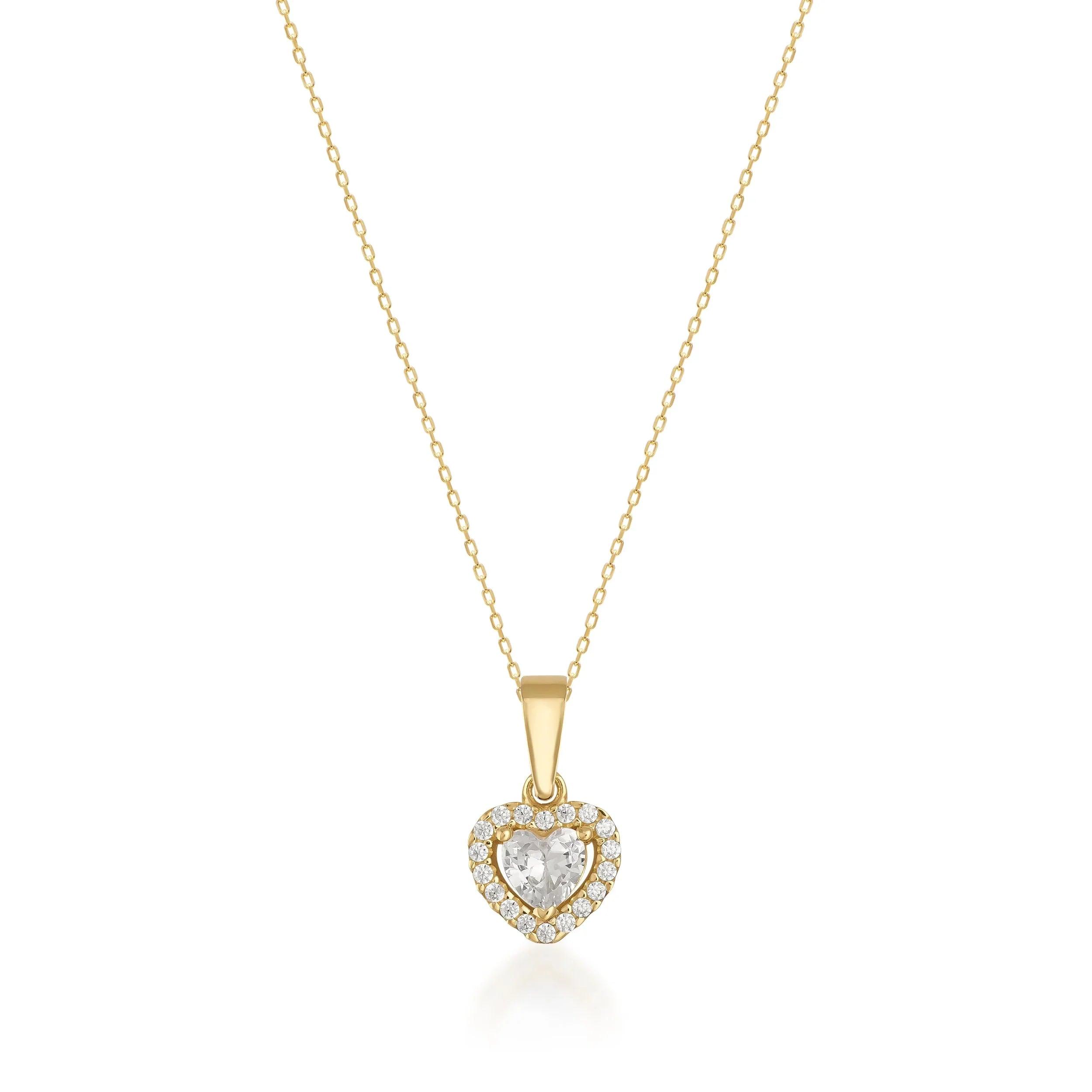 Gold necklace with heart-shaped diamond pendant and halo of small diamonds on white background