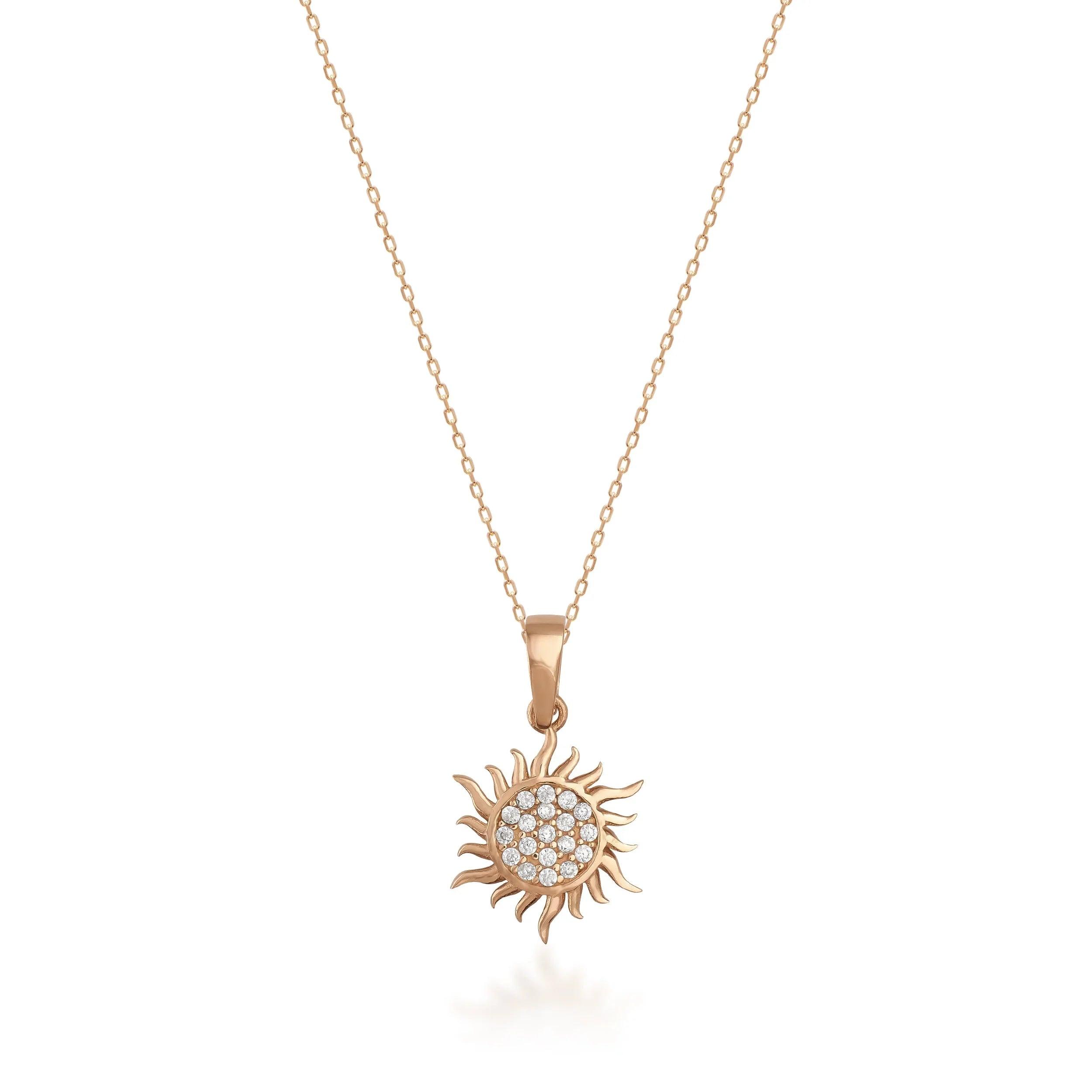 Gold sun pendant necklace with sparkling round diamonds on a delicate chain