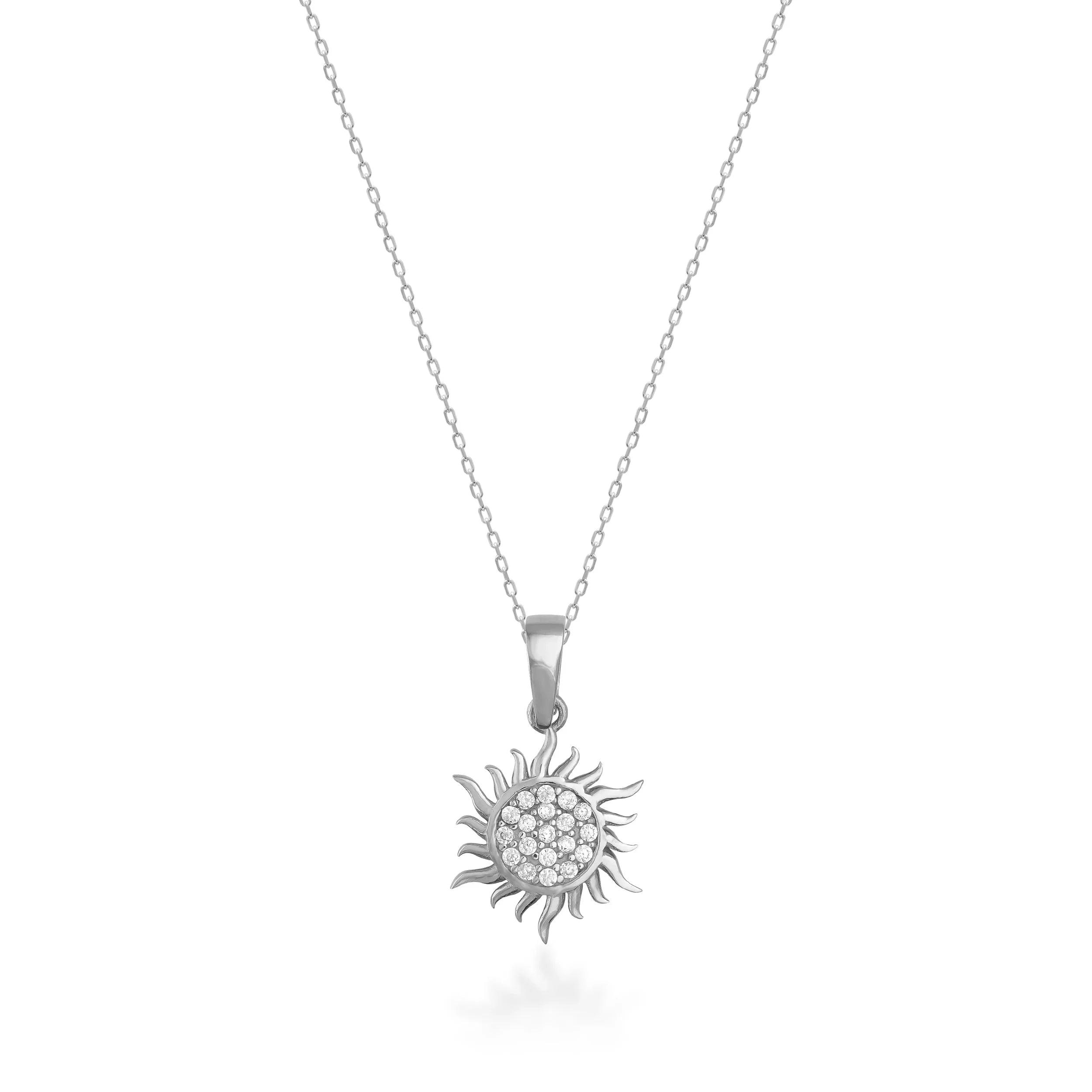 White gold sunburst pendant necklace with pavé-set stones on a delicate chain