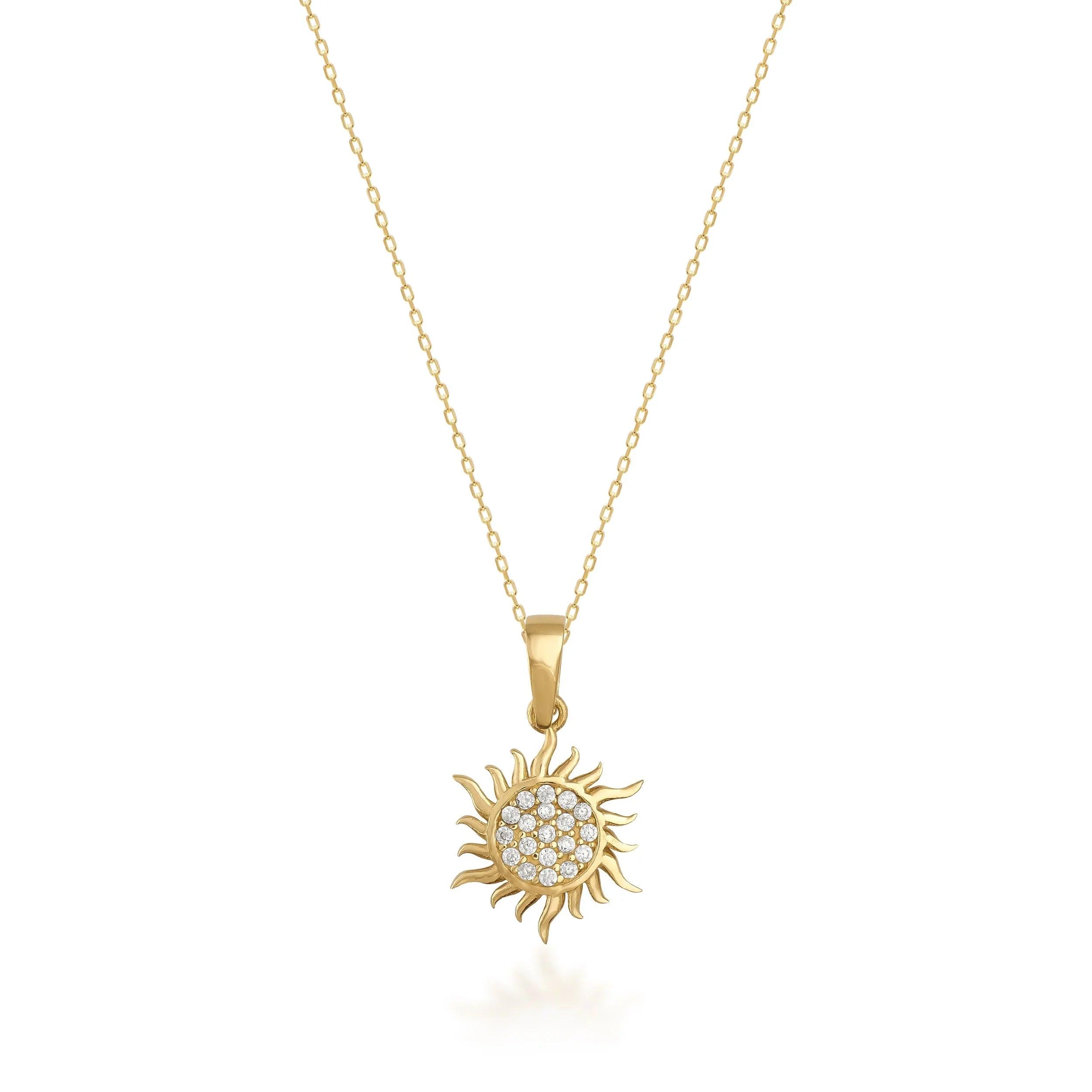 Gold sun pendant necklace with diamond accents on fine gold chain, elegant jewelry