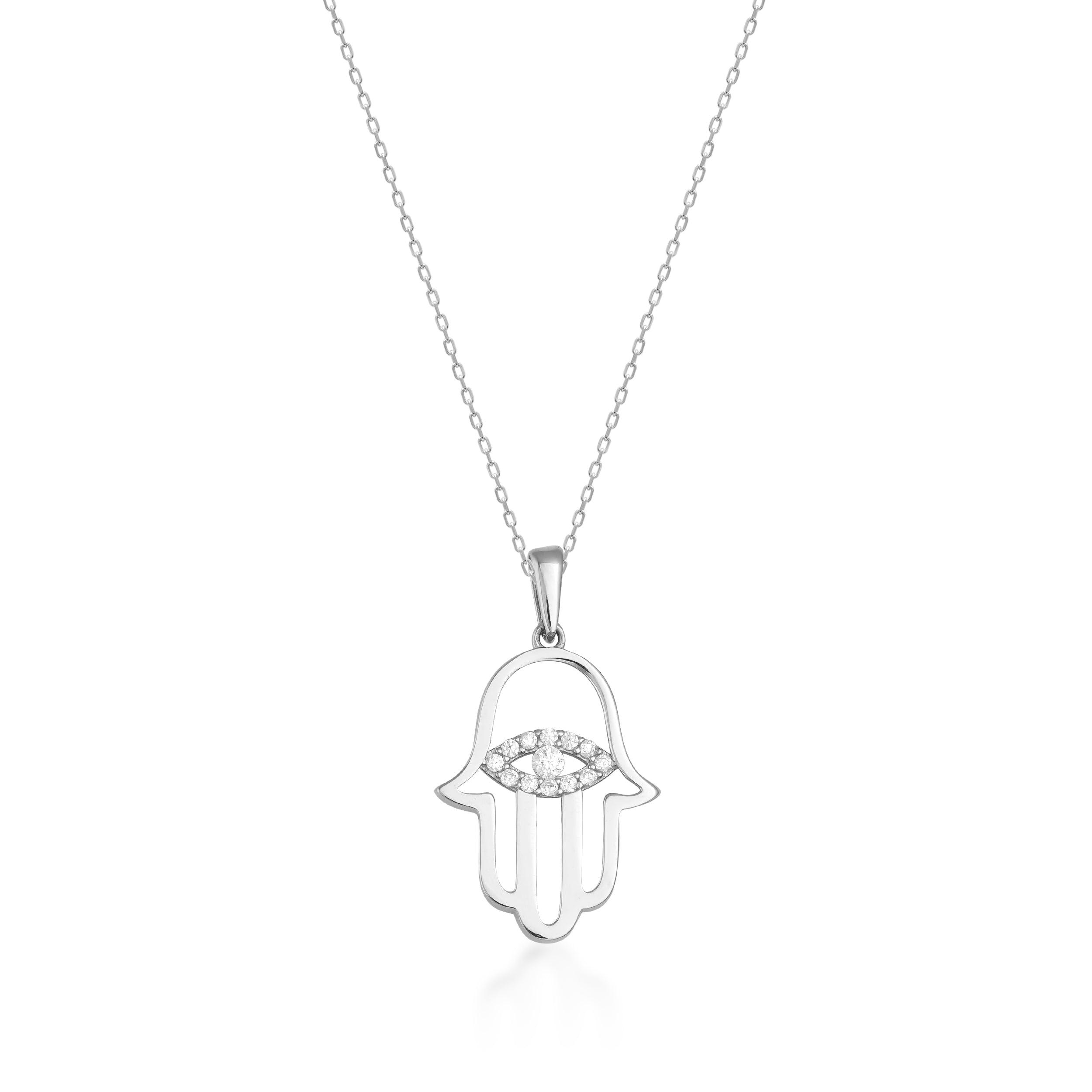 Gold chain necklace with diamond Hamsa hand and eye pendant on white background