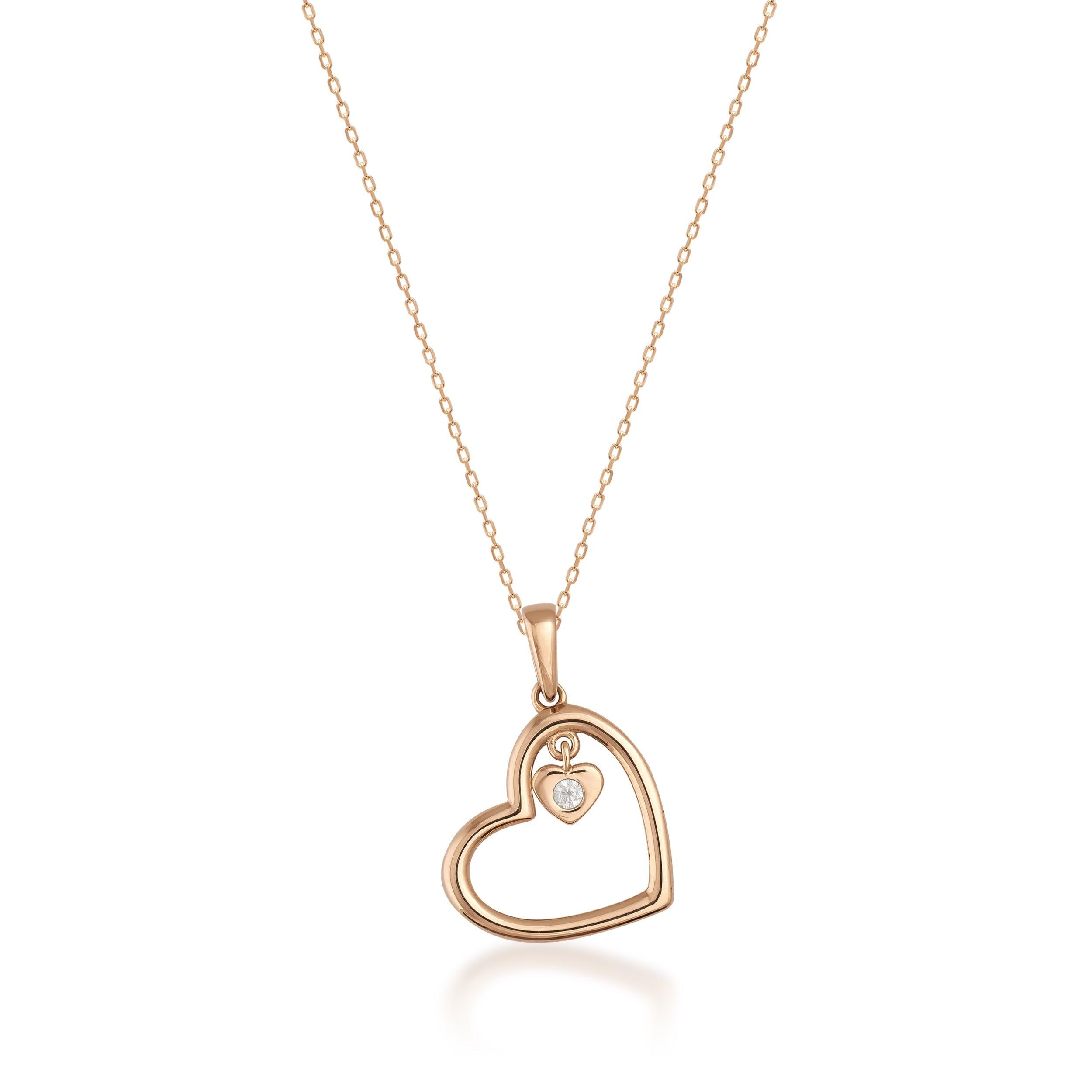Gold heart pendant necklace with small diamond accent on delicate chain