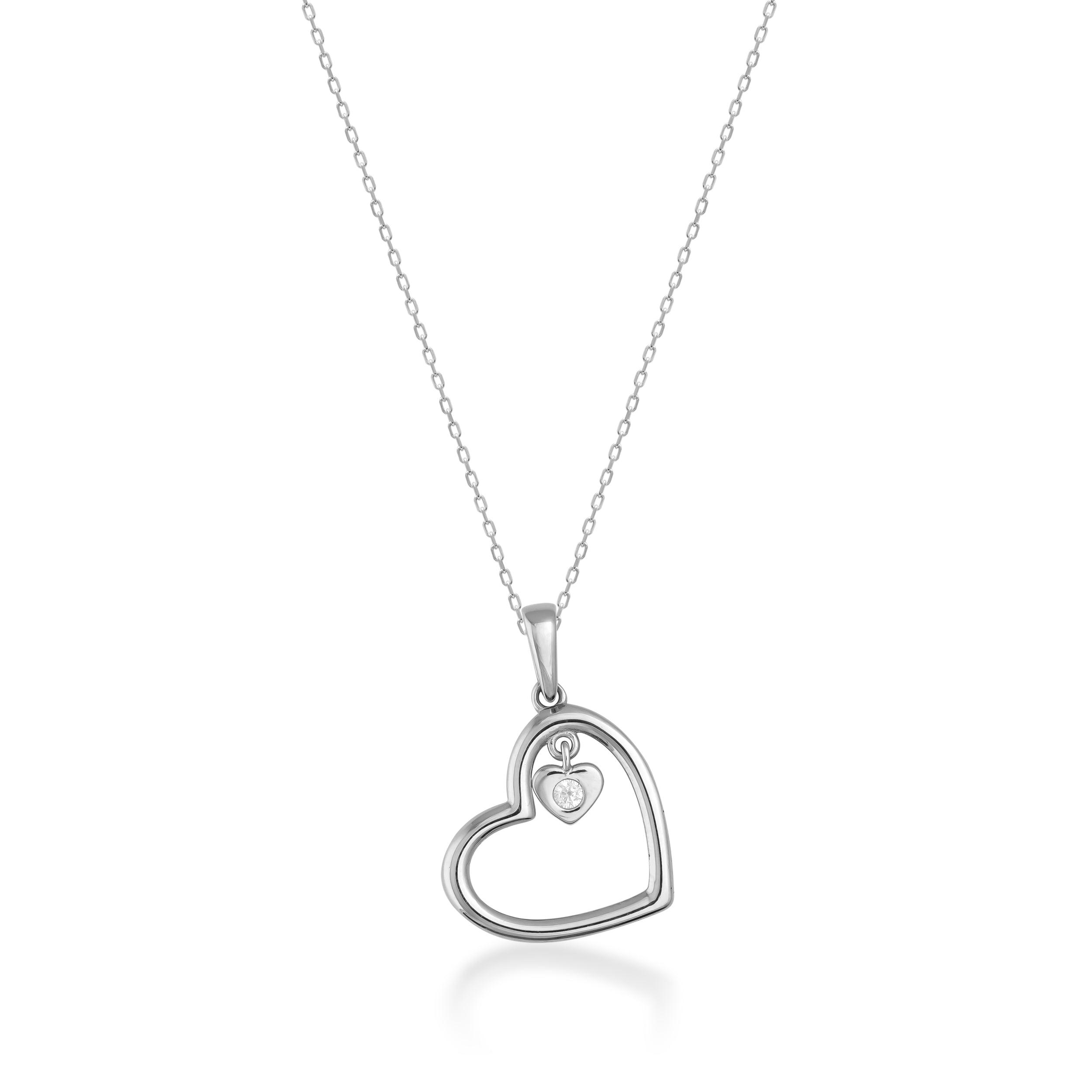 White gold heart pendant necklace with small diamond accent on plain background