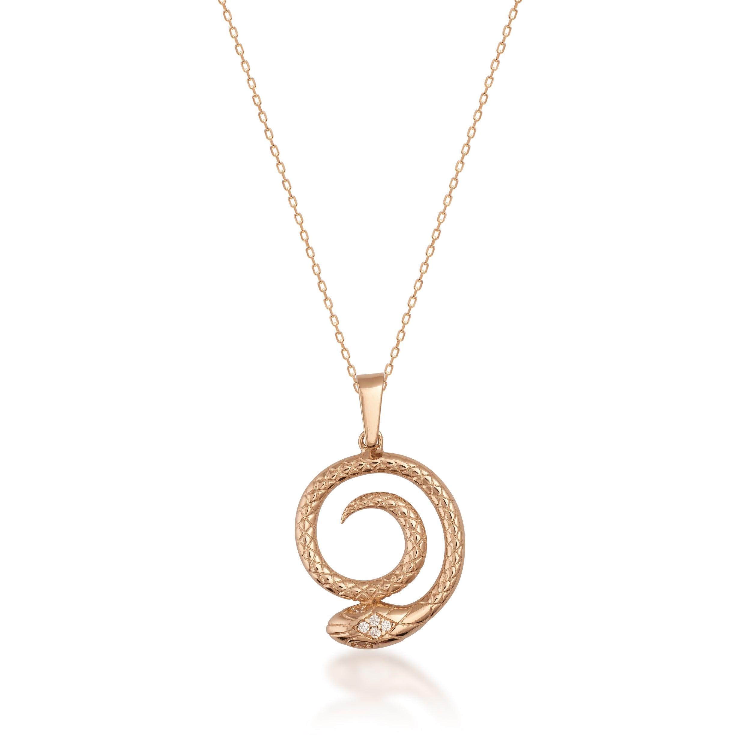 Gold snake pendant necklace with diamond details on fine chain, elegant jewelry