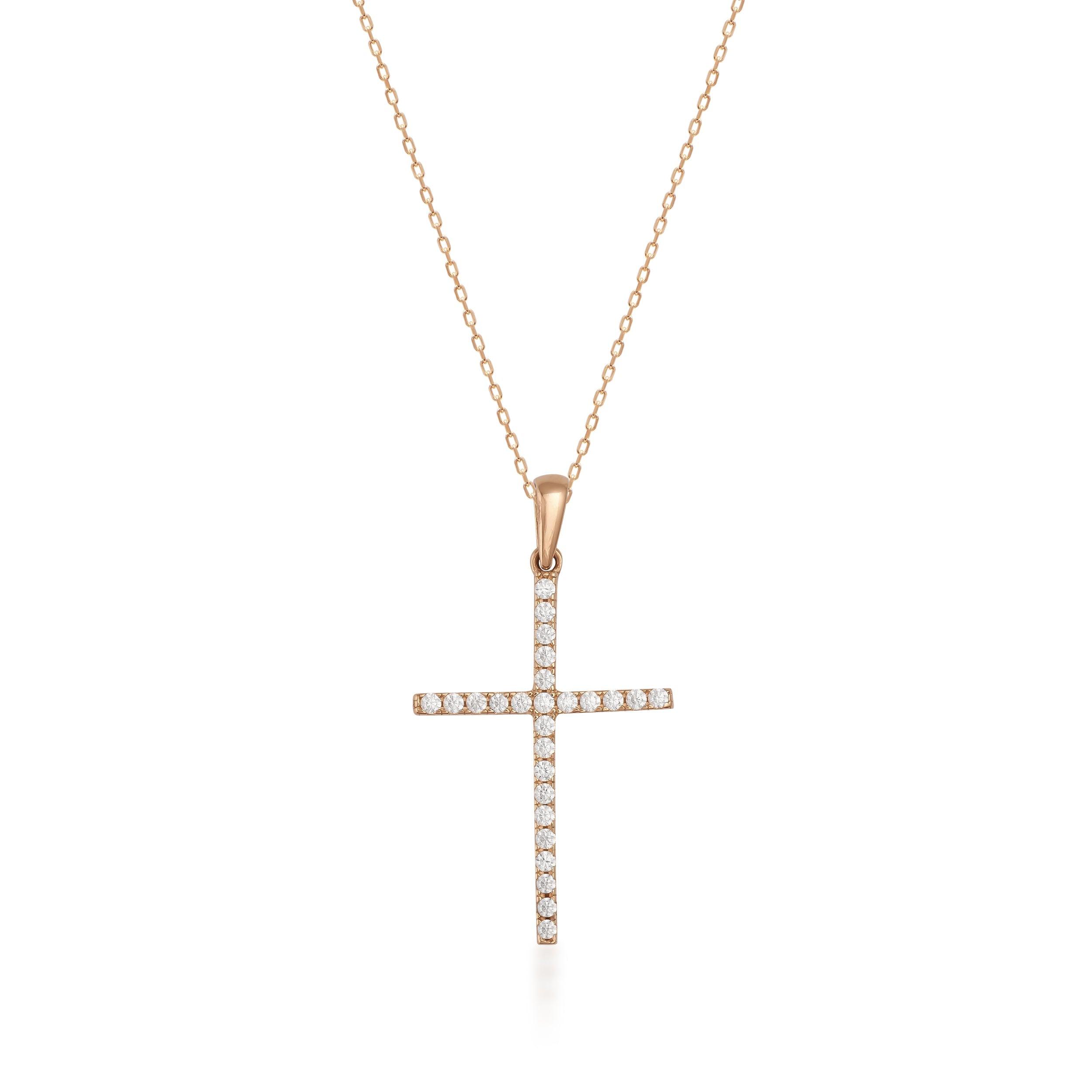 Gold necklace with diamond cross pendant on white background