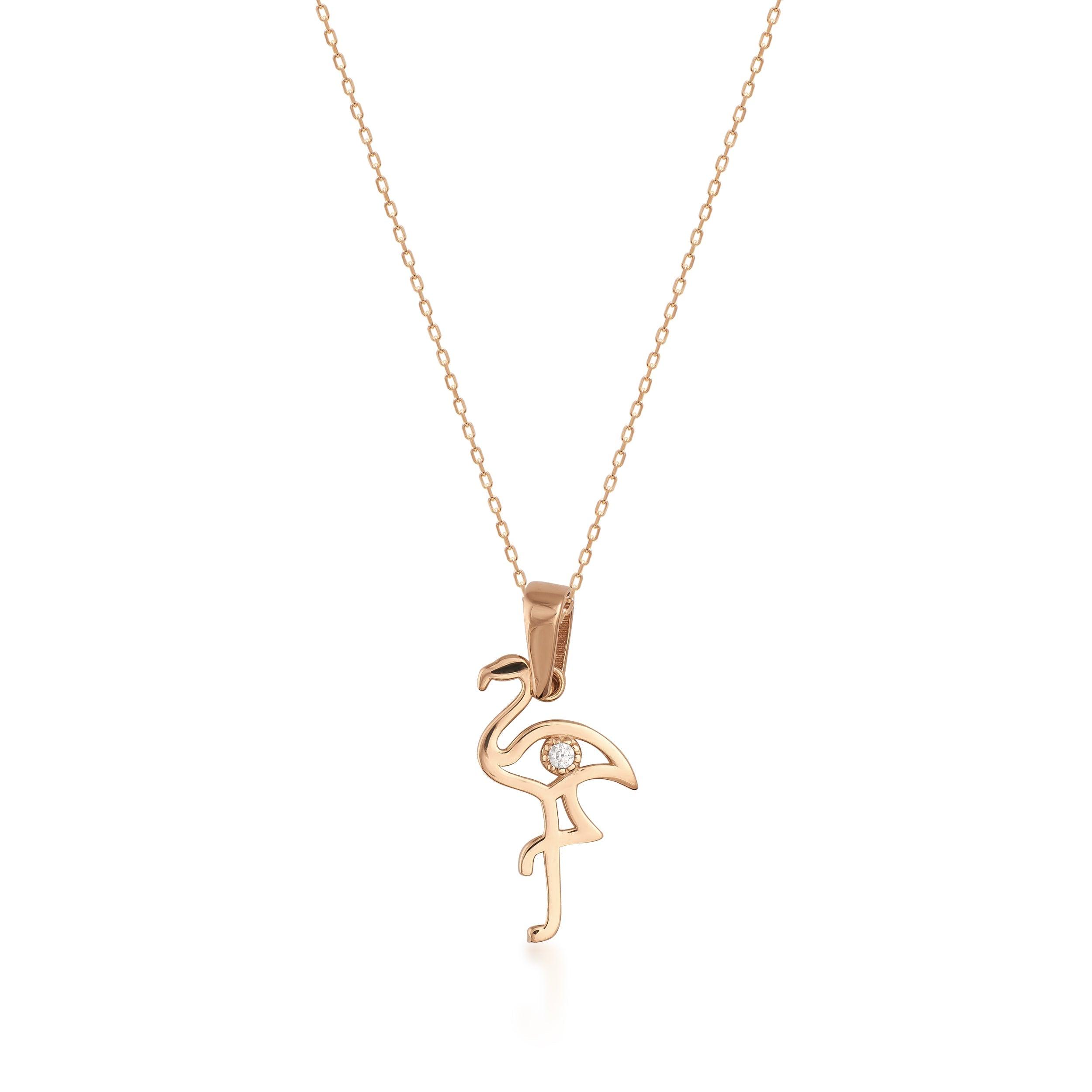Delicate gold flamingo pendant necklace with a small gemstone on a fine gold chain
