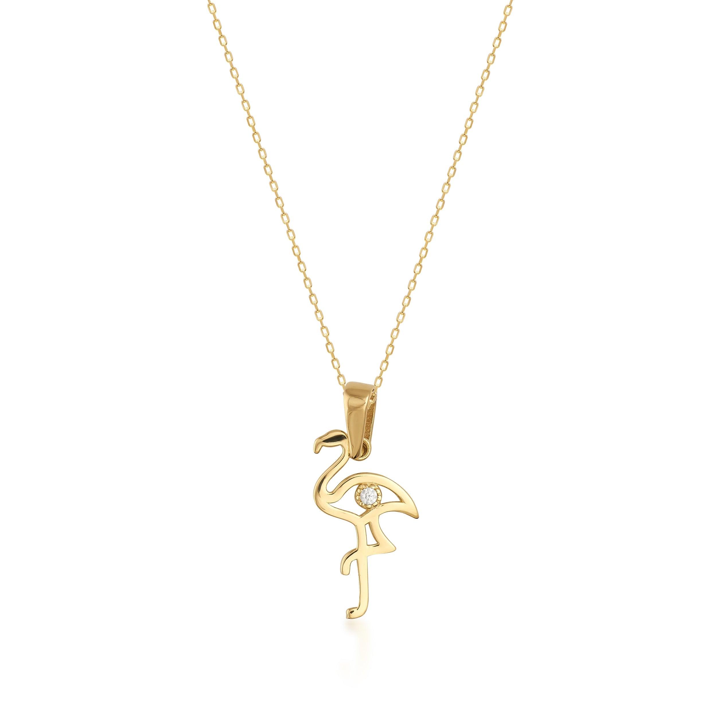 Gold necklace with flamingo-shaped pendant and small gemstone on white background