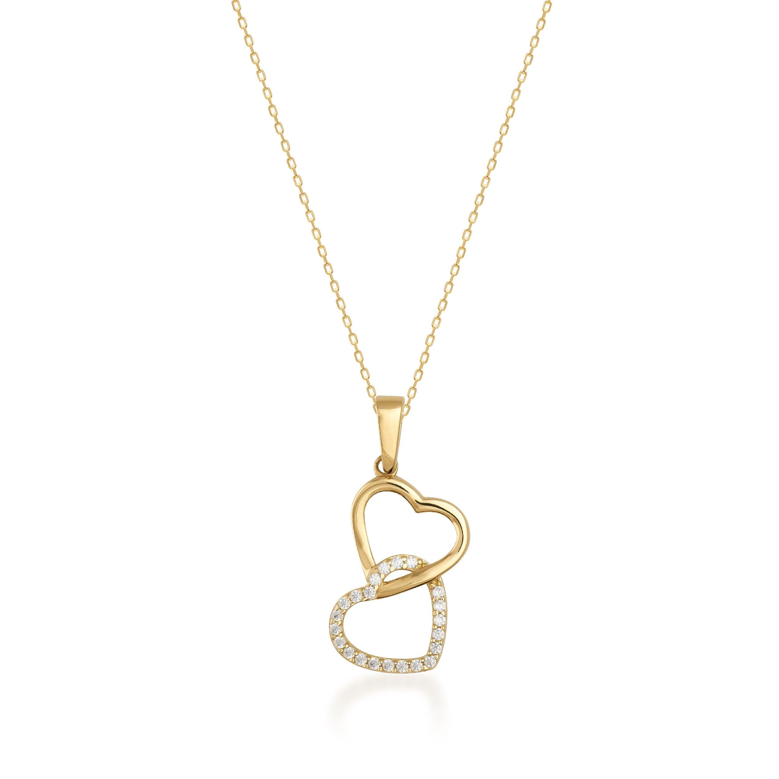 Gold necklace with two interlocking heart pendants, one with sparkling stones