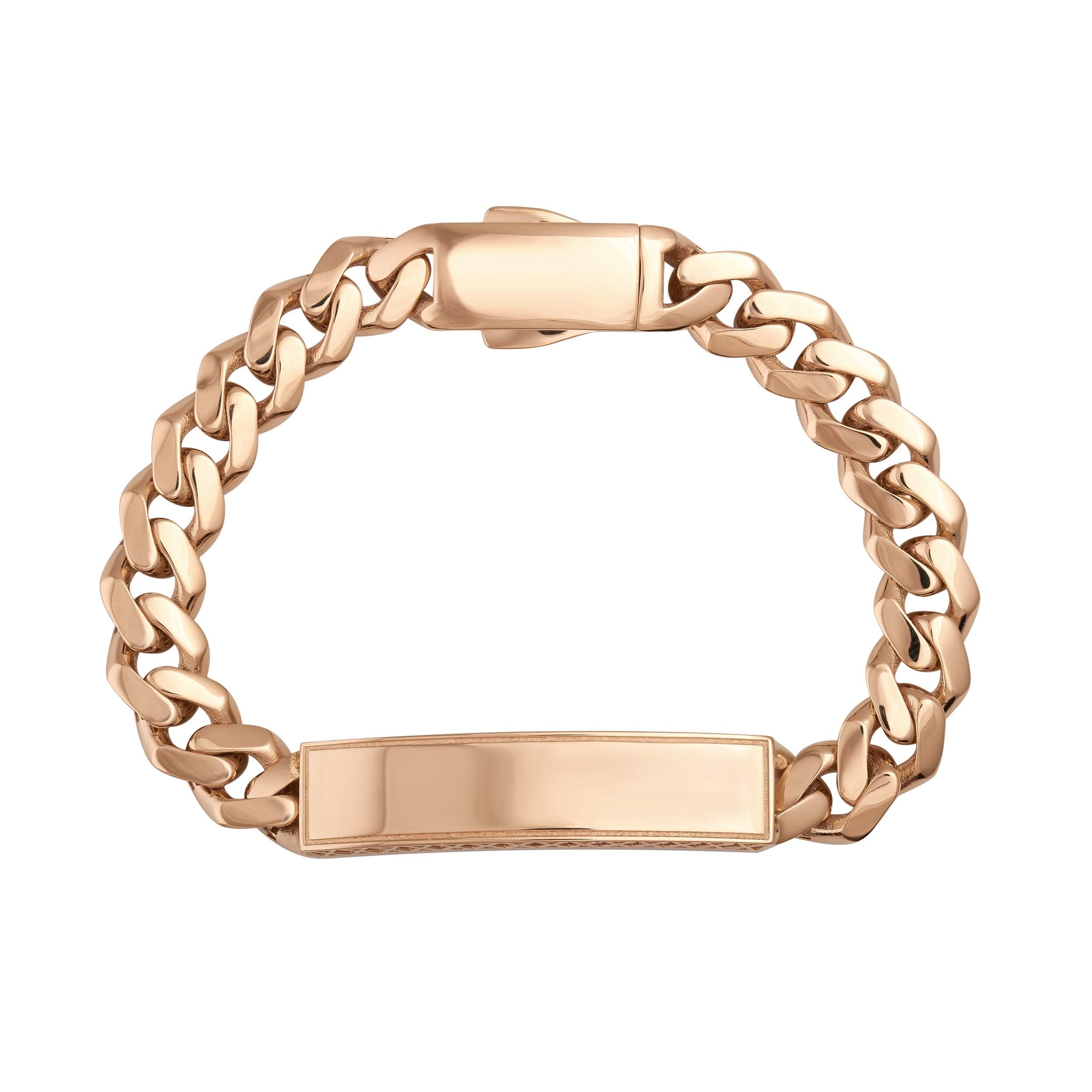 Gold curb chain ID bracelet with a blank polished plate on a white background