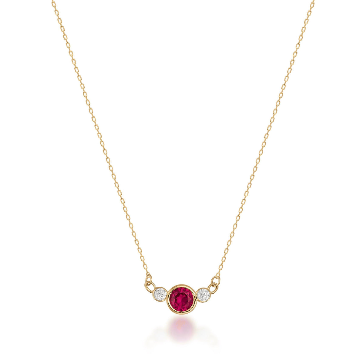 14K gold necklace with central red Simulated Ruby and two small clear stones on white background