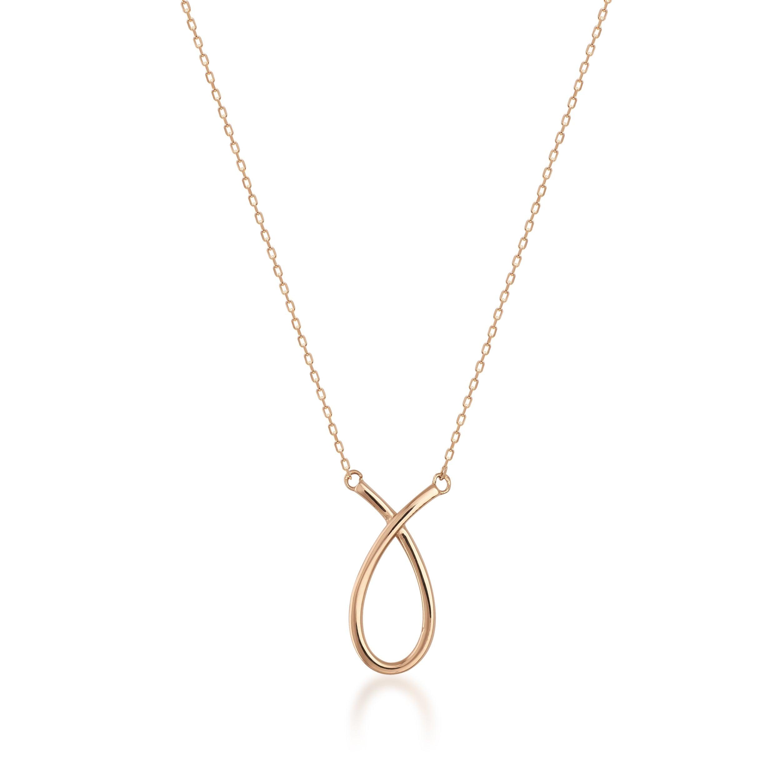Gold loop pendant necklace with minimalist design on fine gold chain, isolated on white