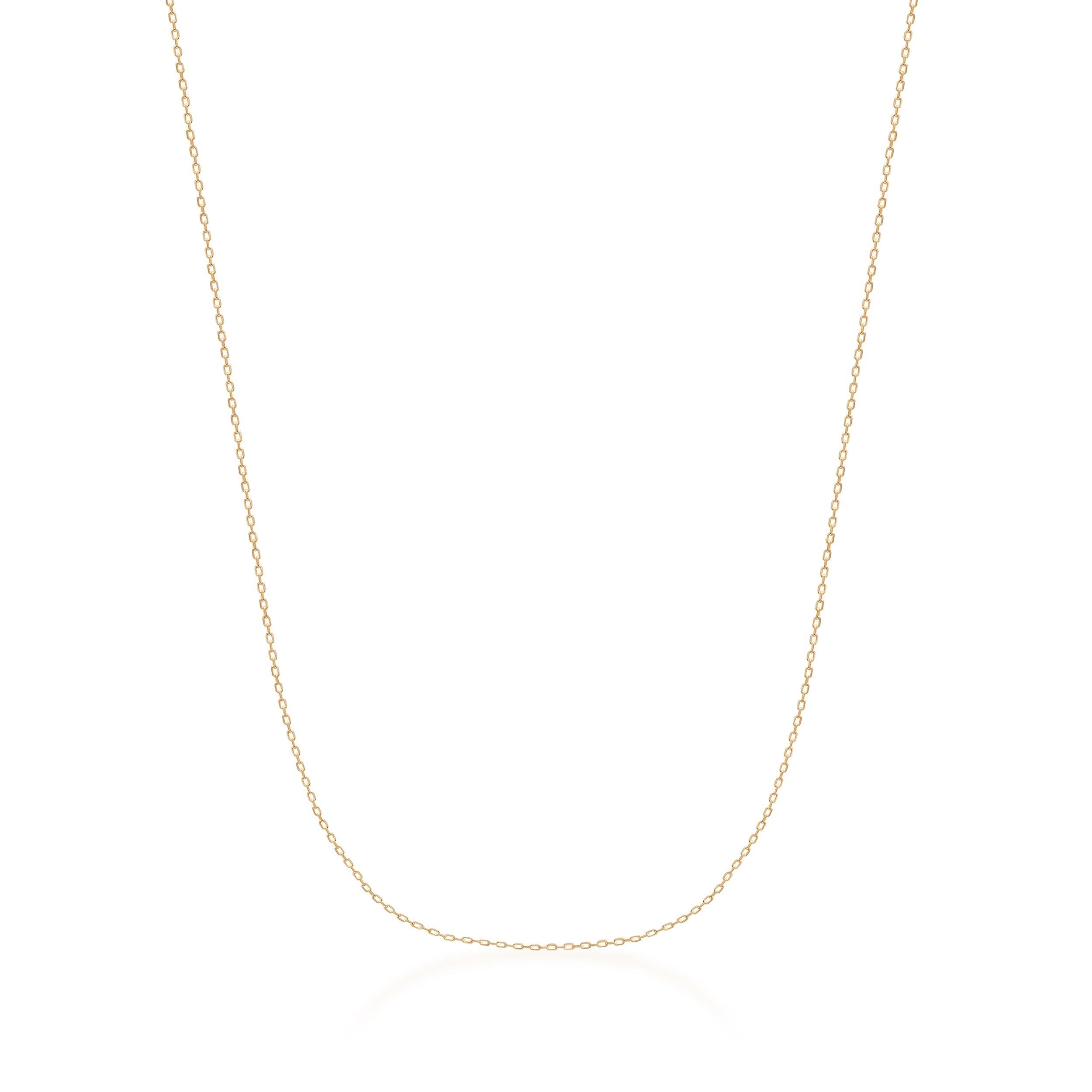 Delicate gold chain necklace on white background, minimalist fine jewelry