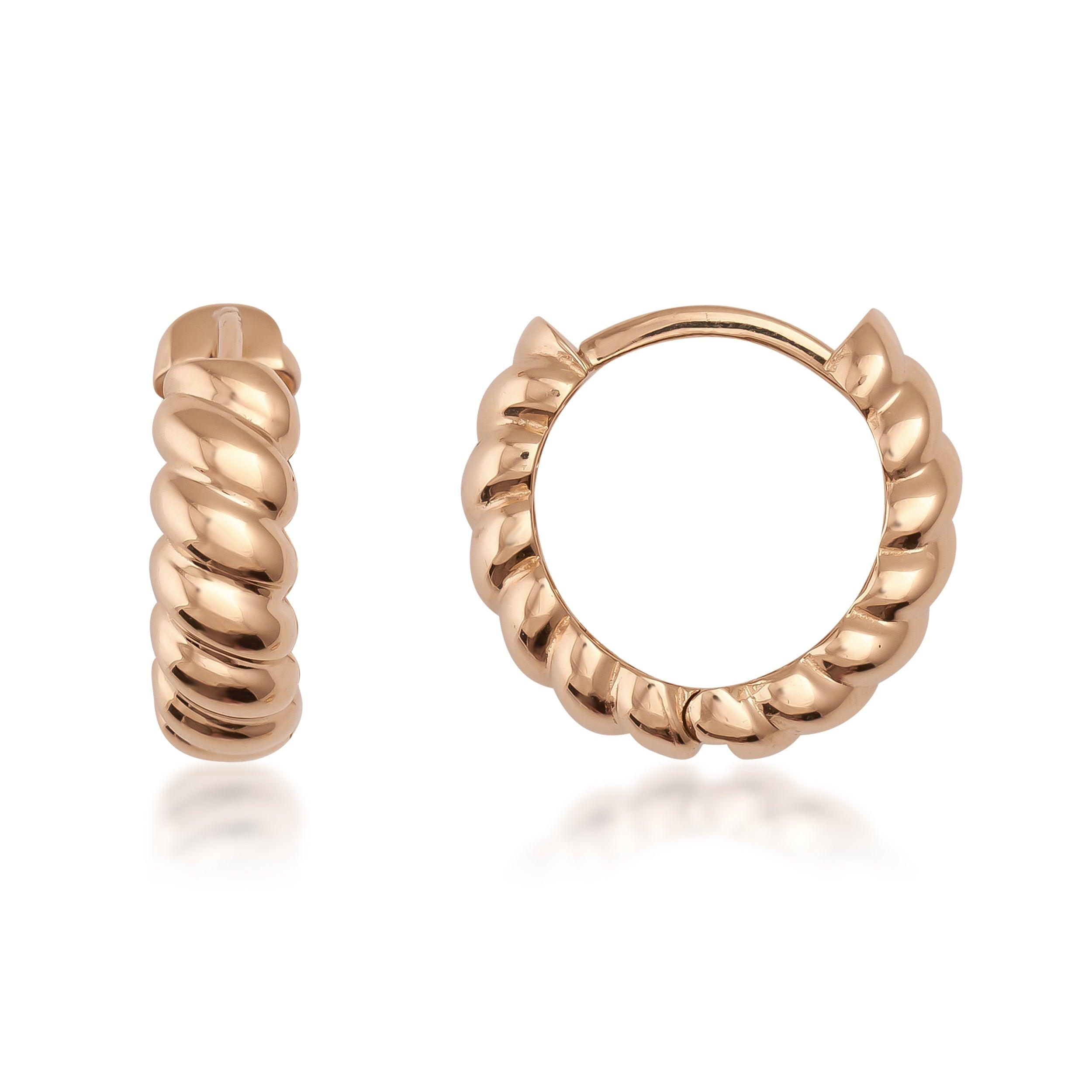 Gold twisted hoop earrings with a polished, ribbed design on a white background
