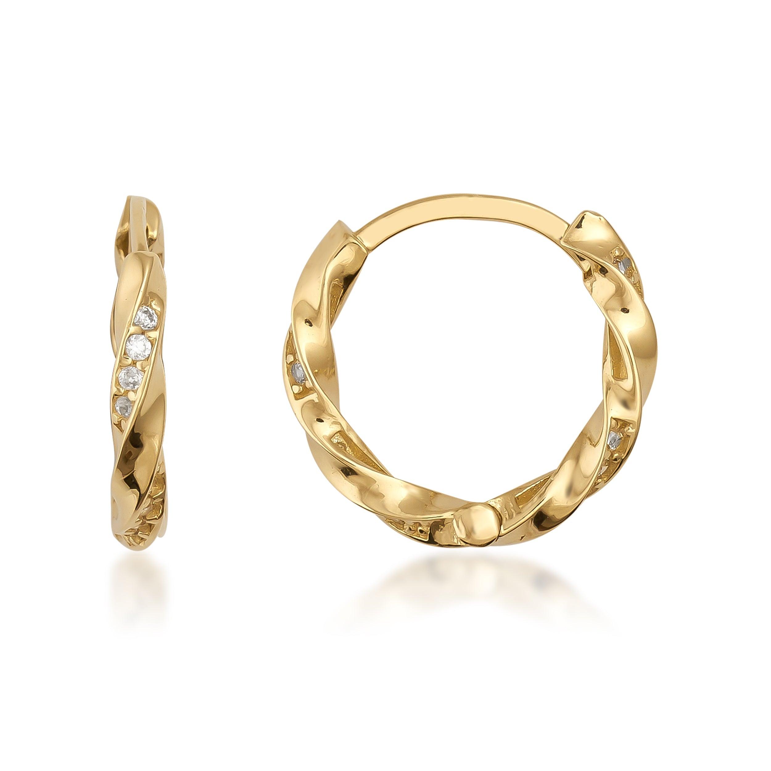 Twisted gold hoop earrings with small embedded clear stones on white background
