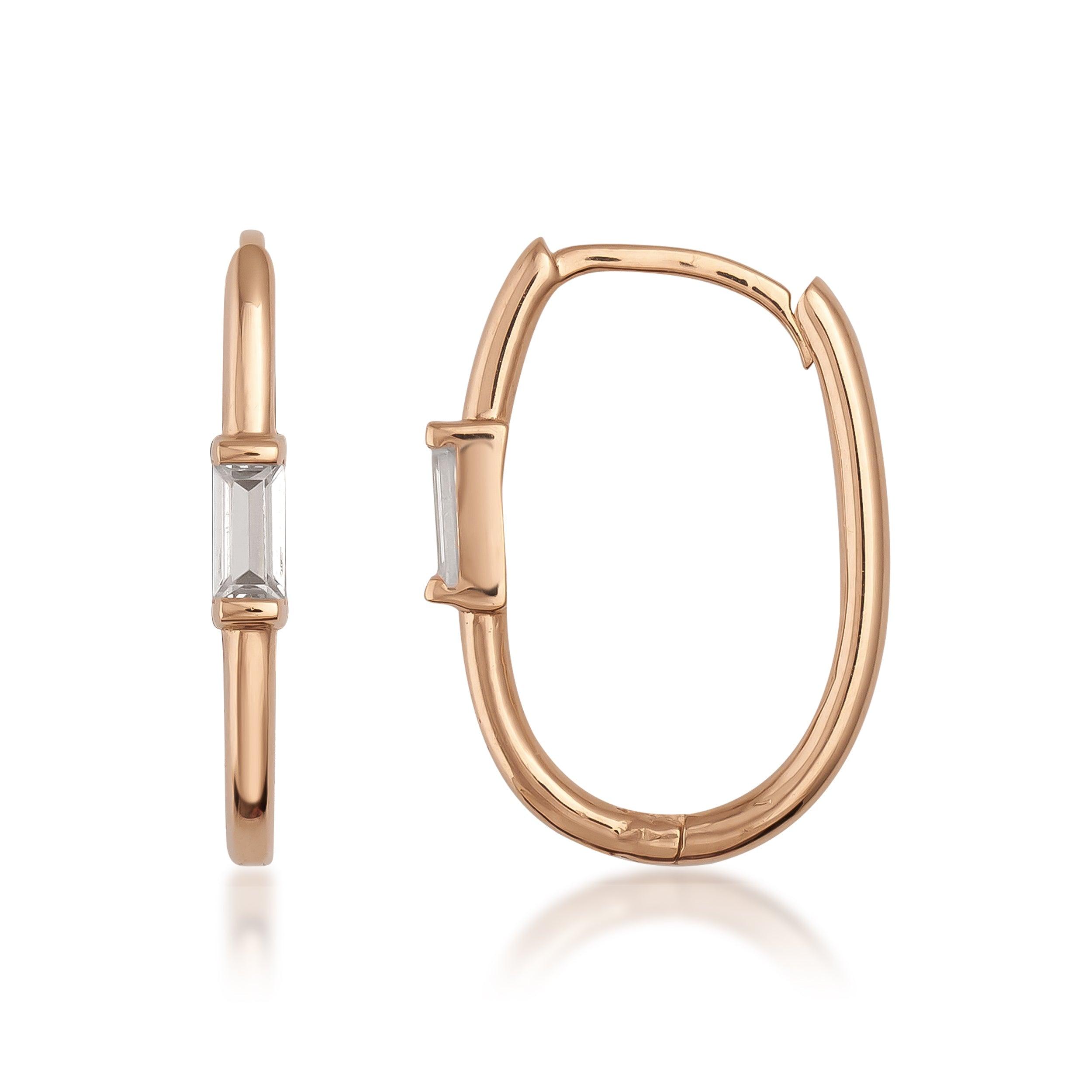 Rose gold hoop earrings with rectangular clear gemstone on white background
