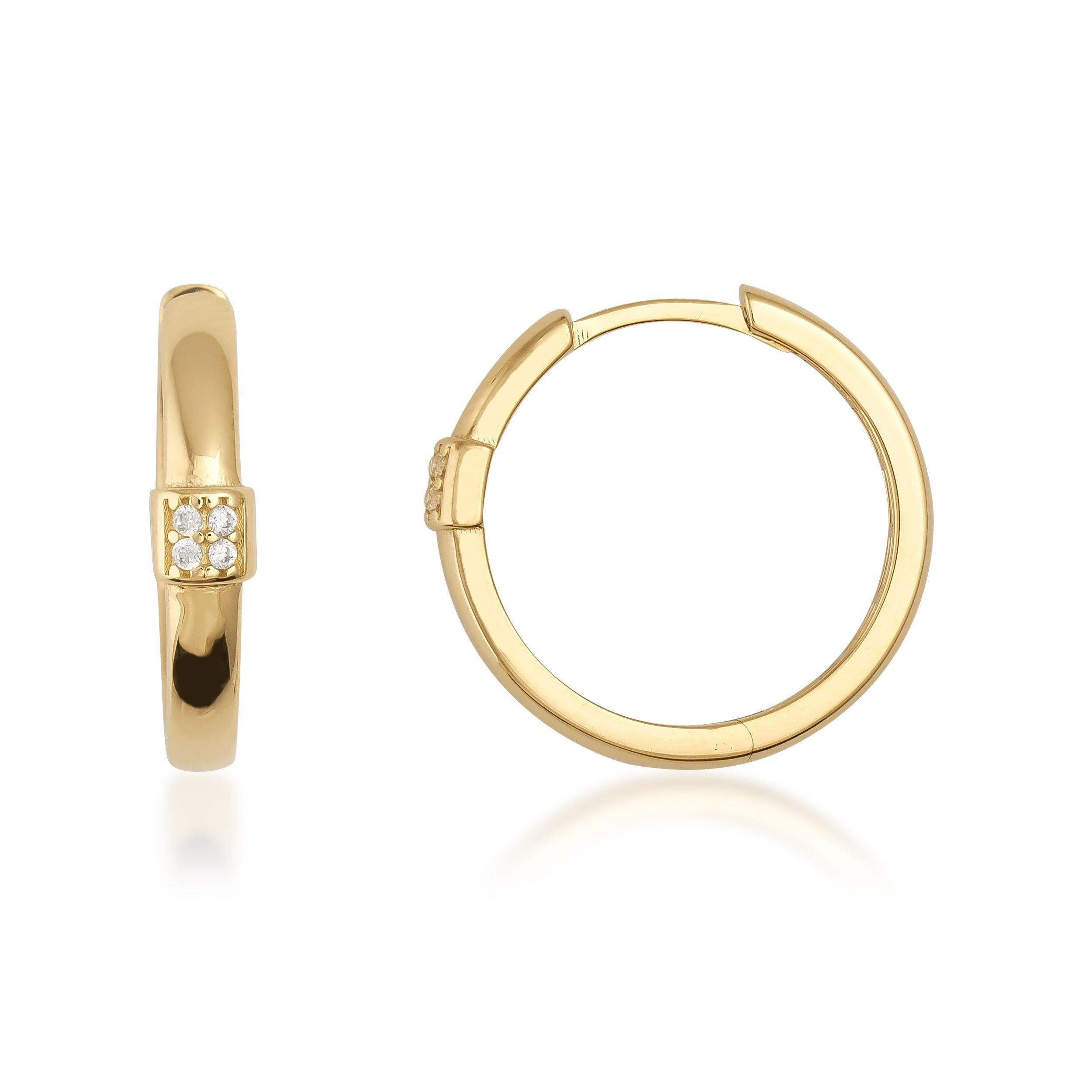 Gold hoop earrings with diamond accents on a white background