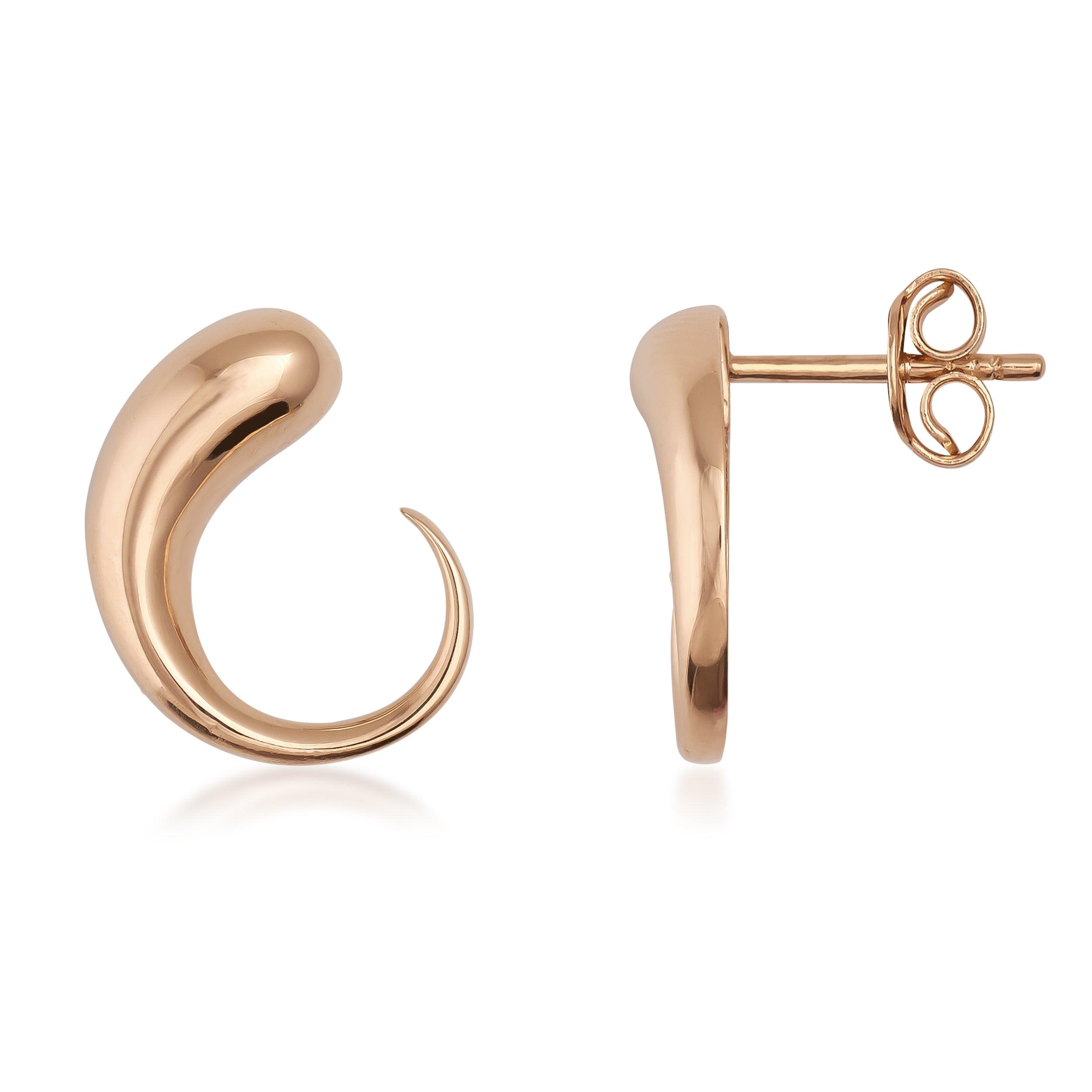 Polished gold stud earrings with a curved, modern abstract design on white background
