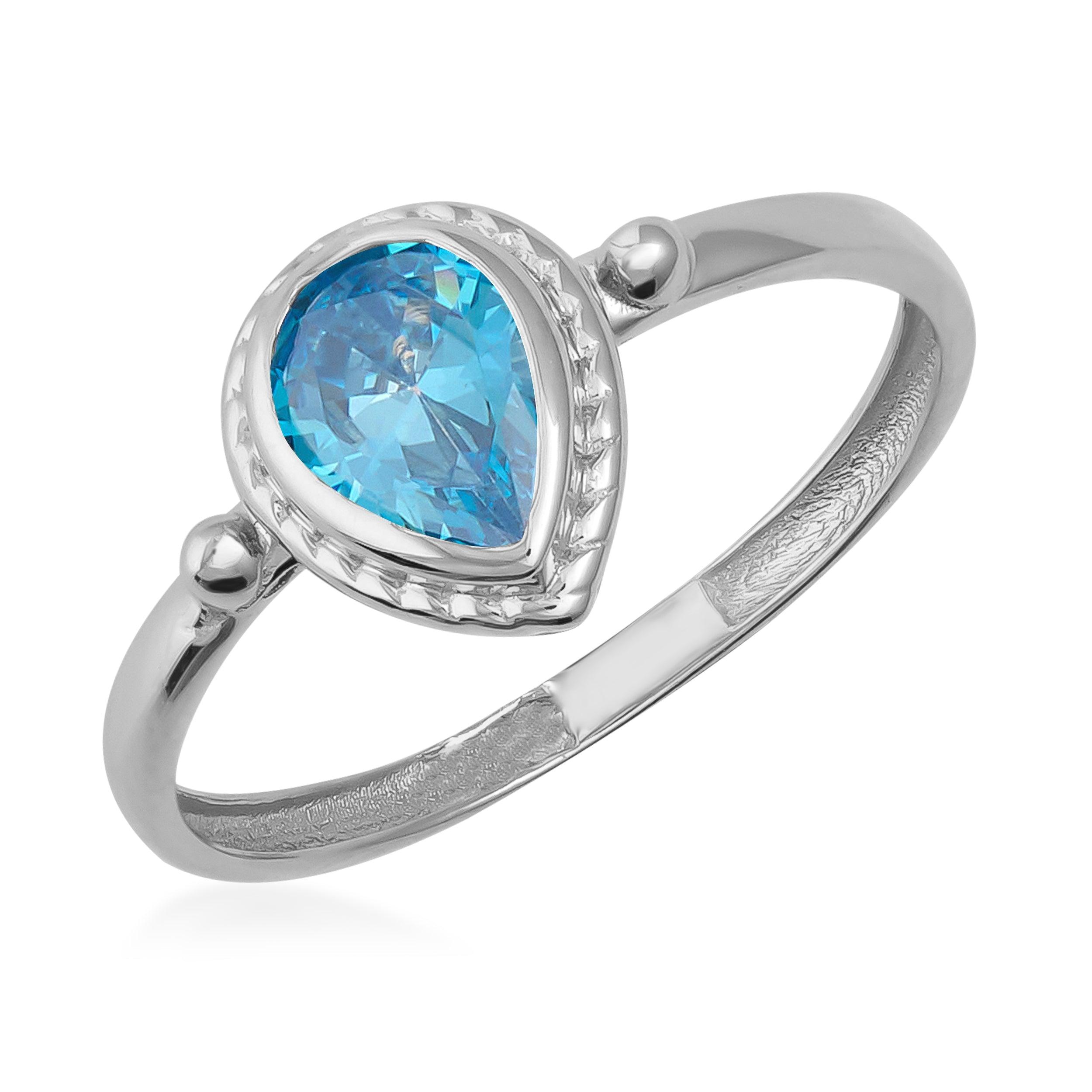 Silver ring with pear-shaped blue gemstone center, elegant and minimalist design