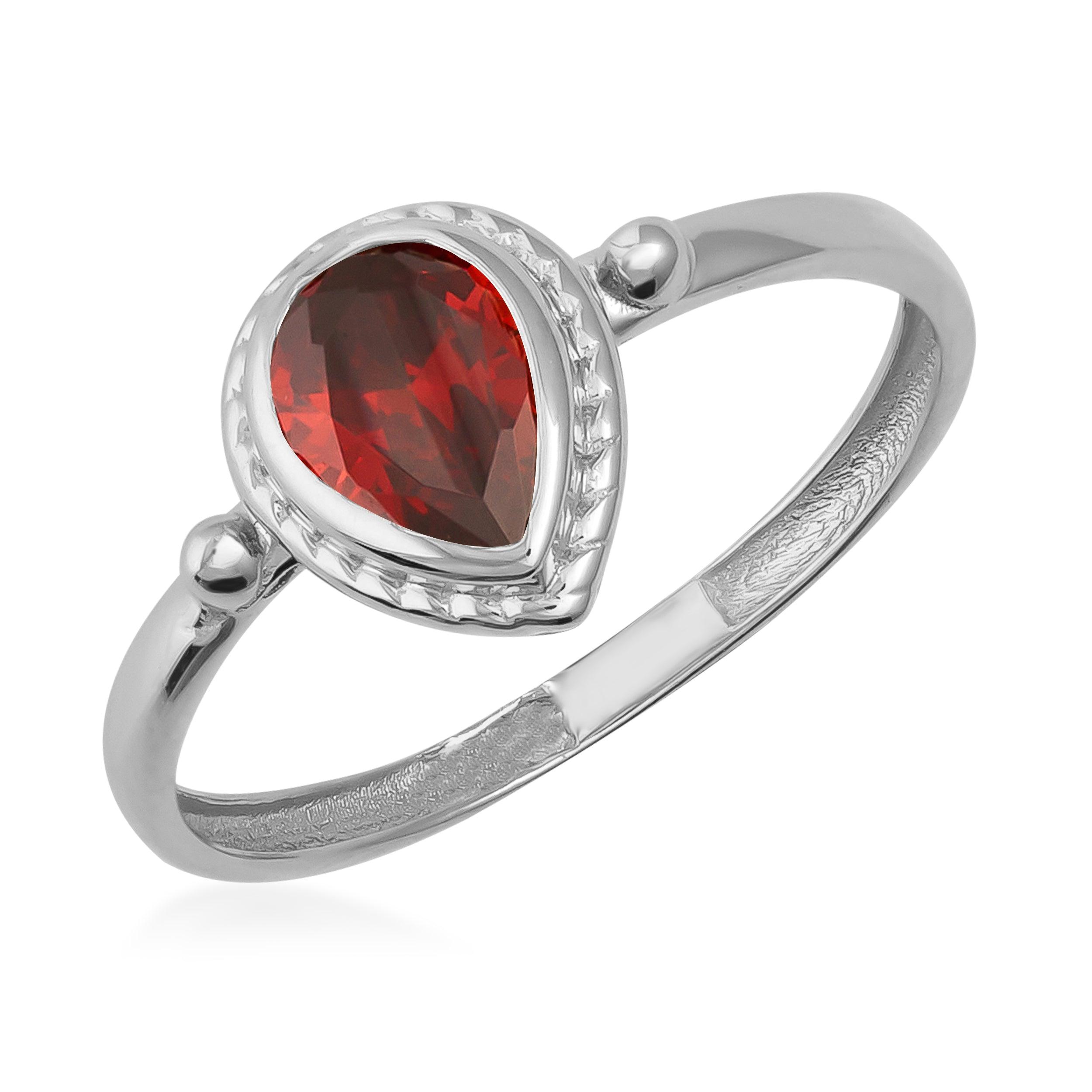 White gold ring with pear-shaped red gemstone, elegant jewelry design