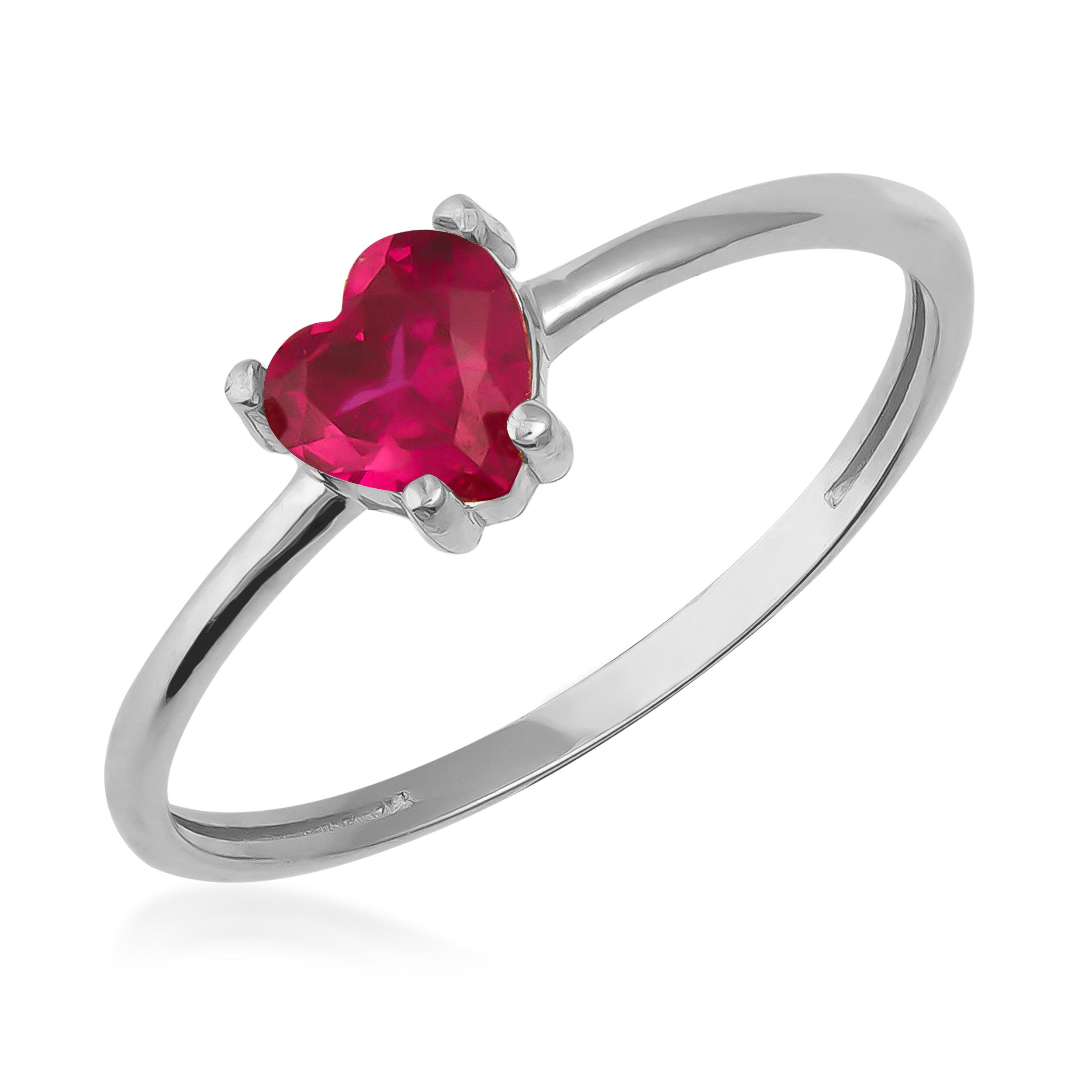 Silver ring with heart-shaped red gemstone solitaire, minimalist jewelry design