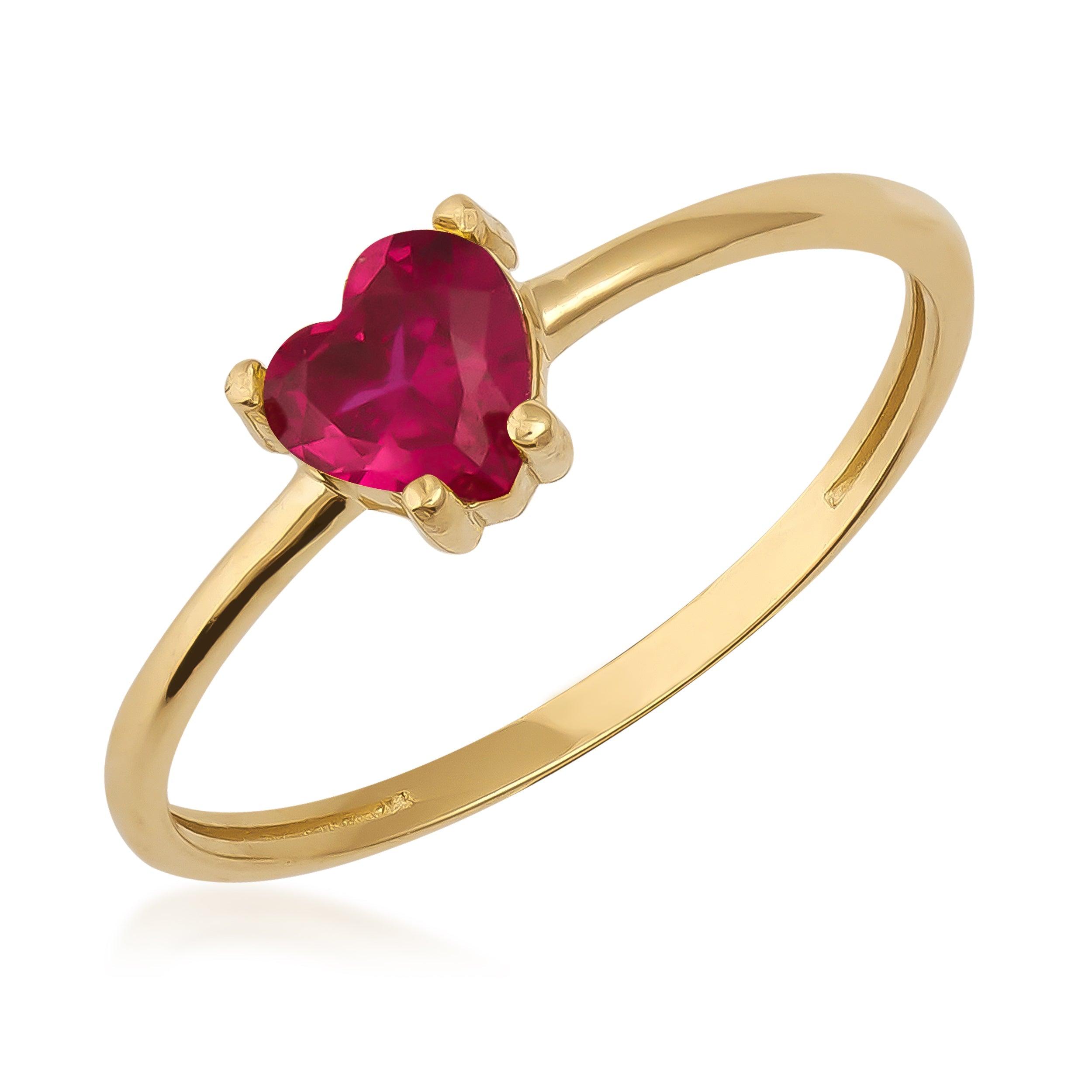 Gold ring with a heart-shaped red gemstone in solitaire setting
