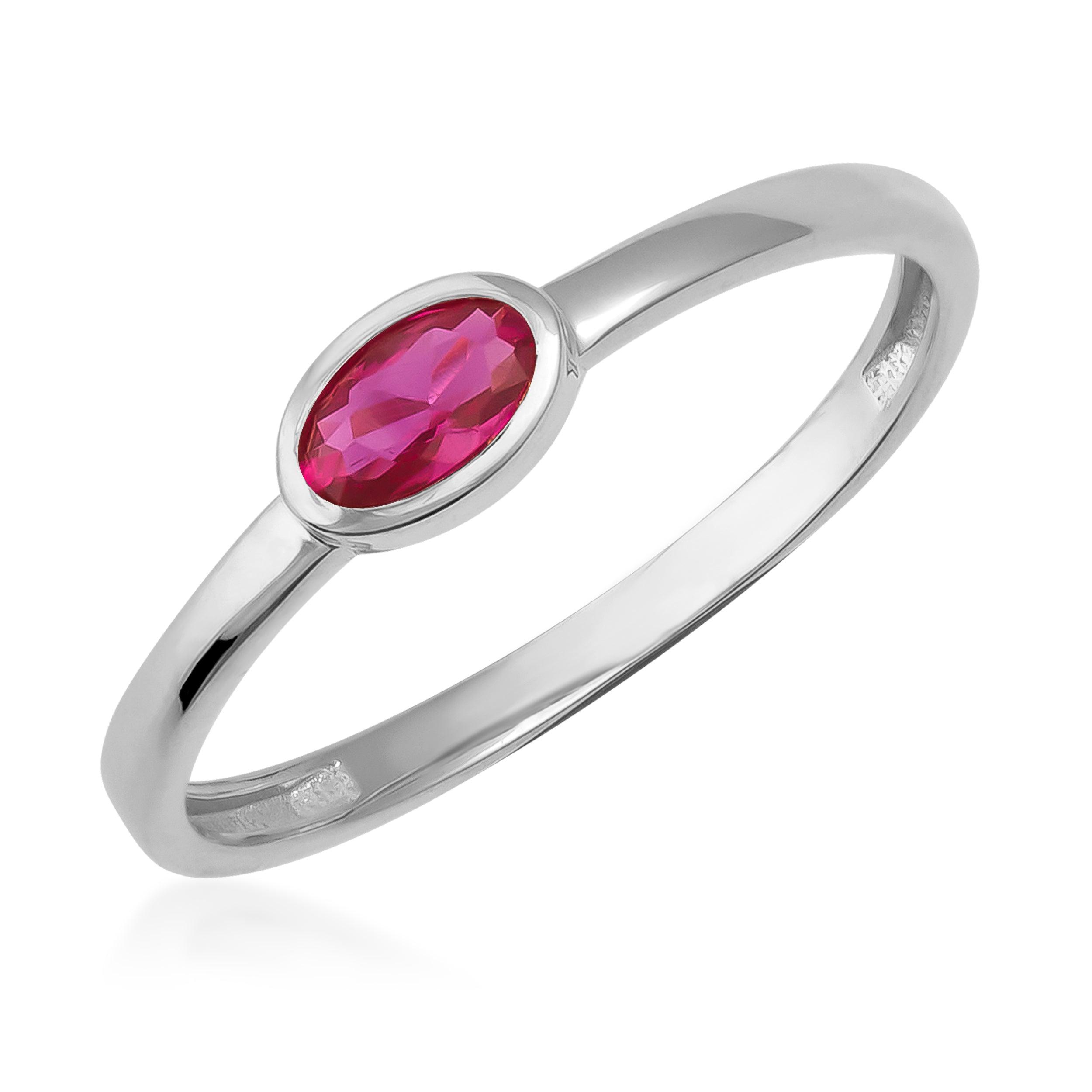 Elegant white gold ring with oval-cut pink gemstone, minimalist jewelry design