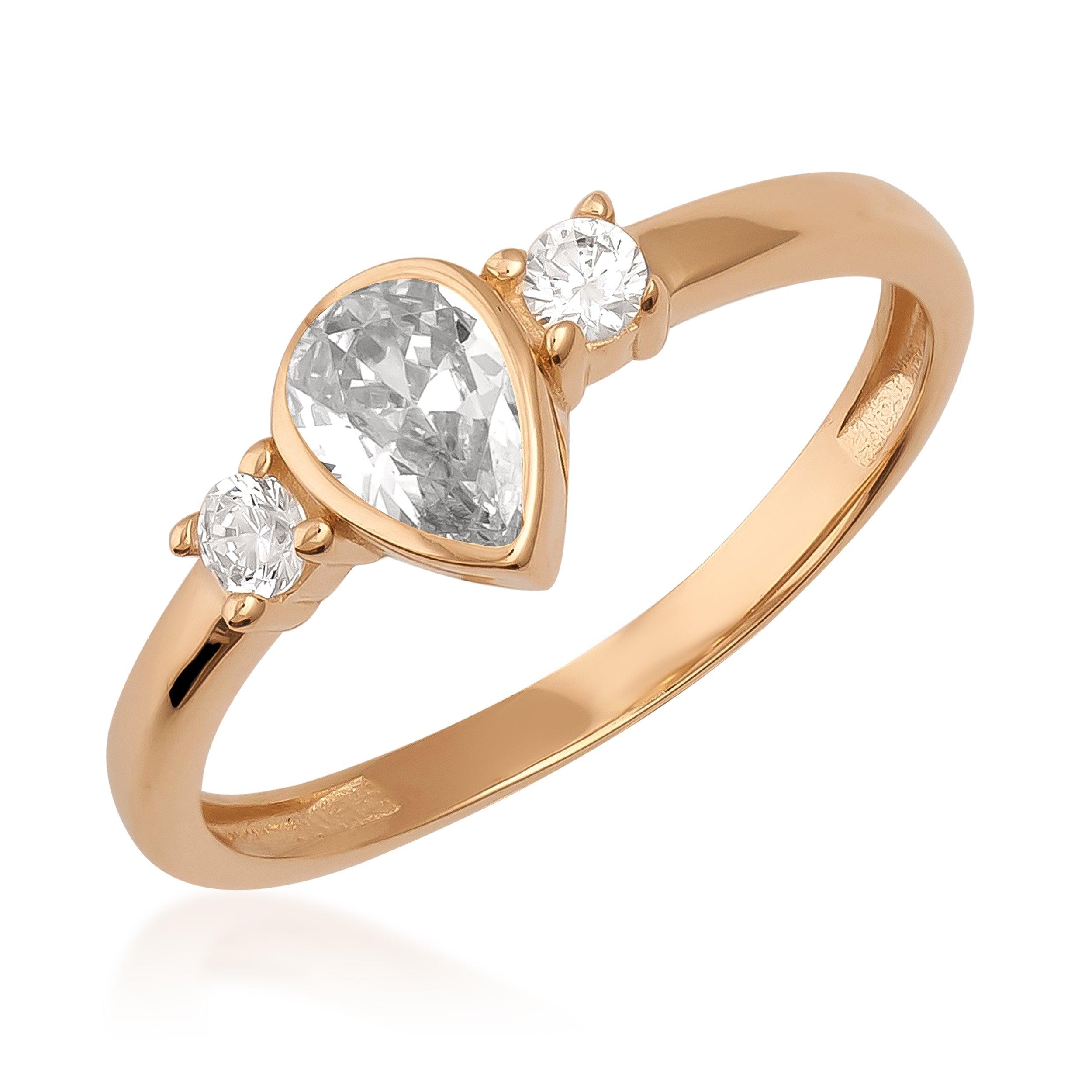 Elegant gold ring with pear-shaped center stone and two round accent gems