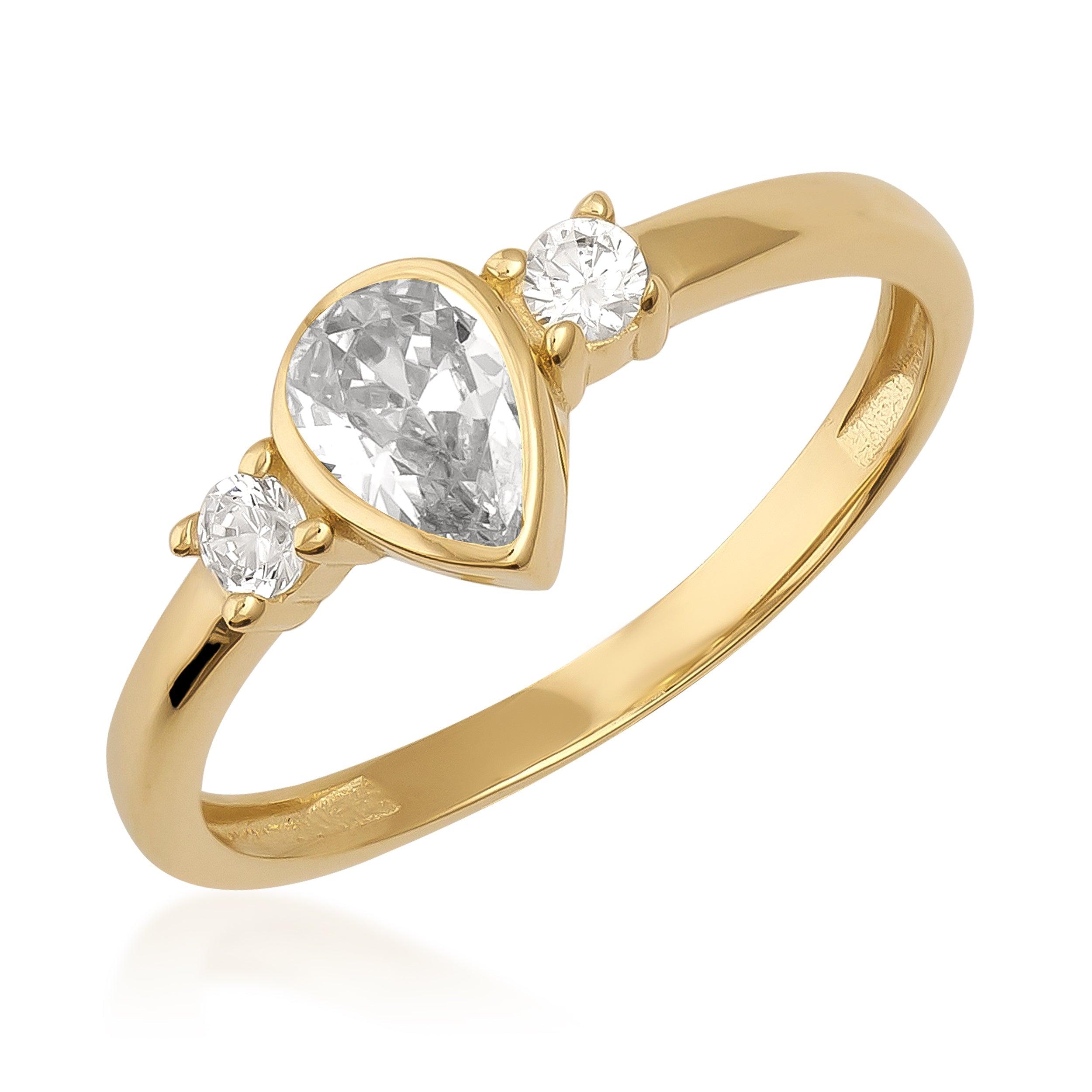 Gold ring with pear-shaped center stone and two round side stones on white background