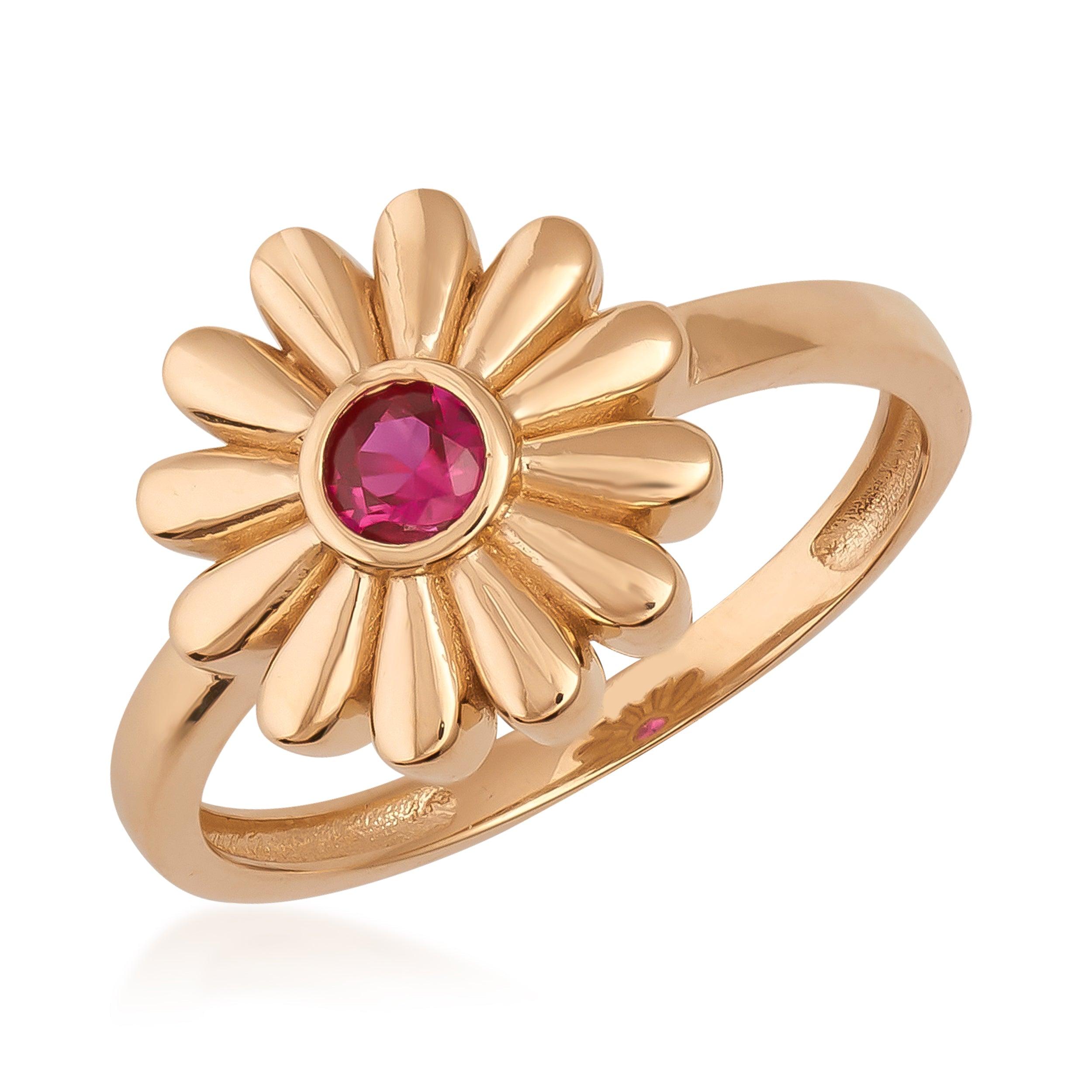 Gold daisy flower ring with pink gemstone center, elegant floral jewelry design