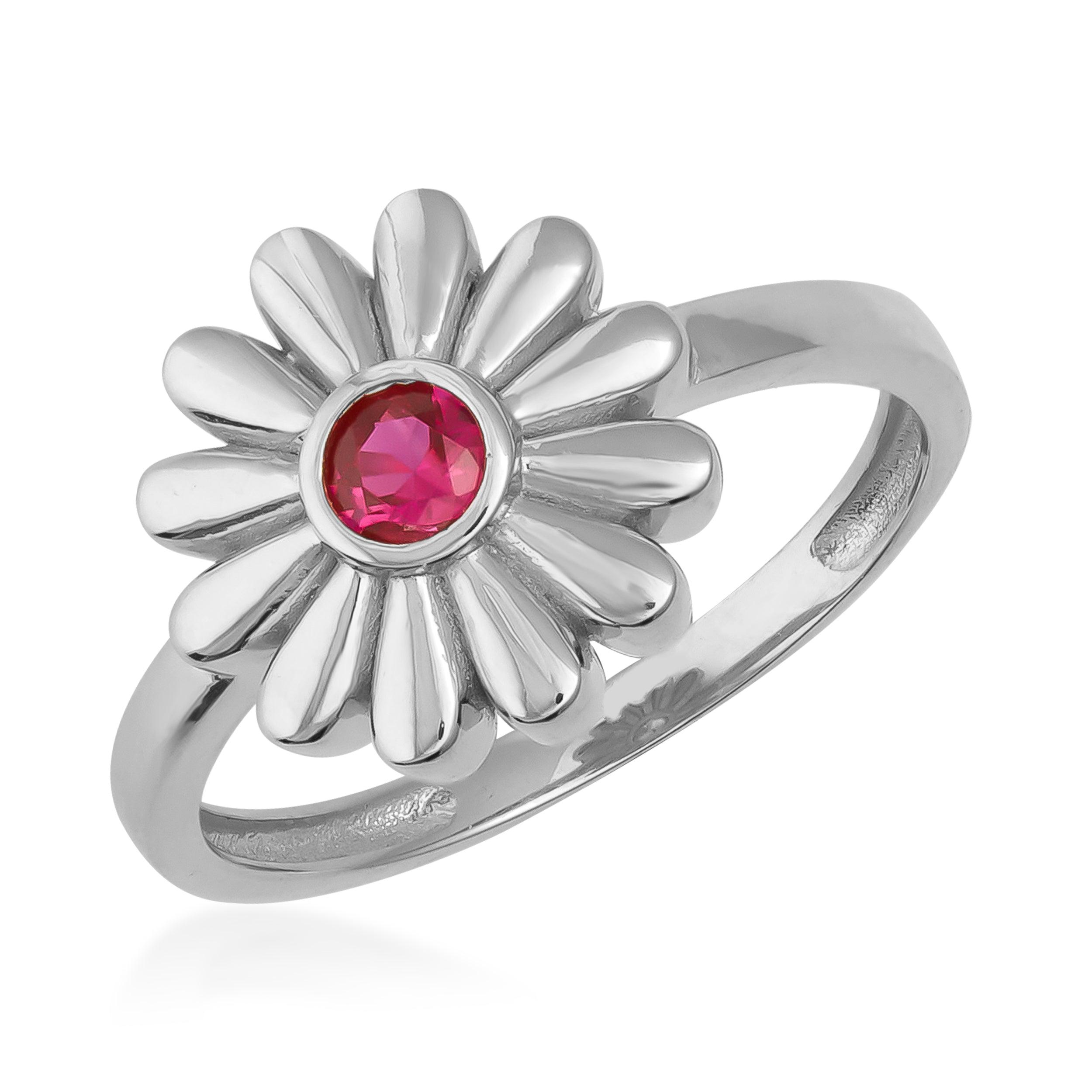 Silver daisy flower ring with pink gemstone center, elegant floral jewelry design