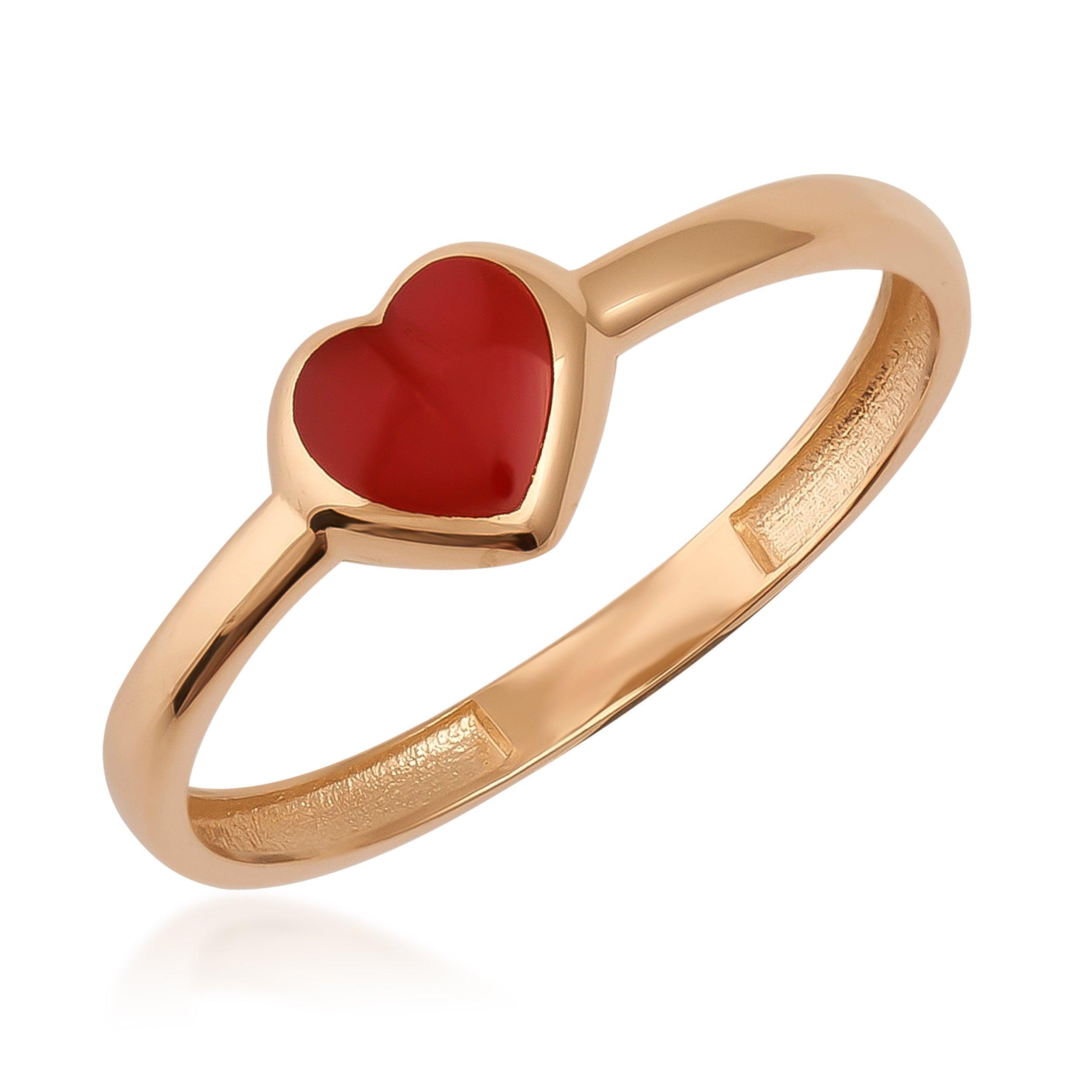 Gold ring with red heart-shaped gemstone, elegant fine jewelry on white background