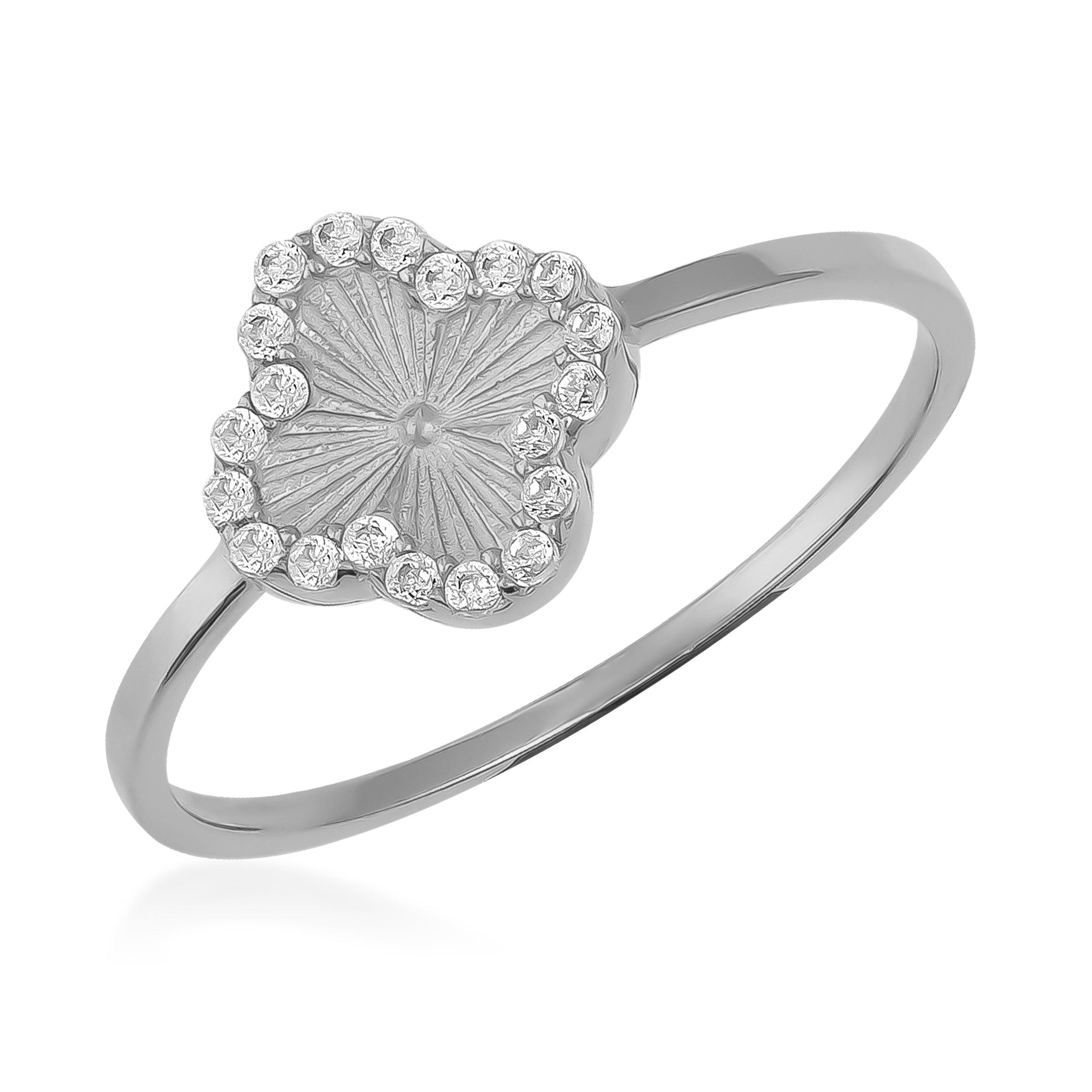 White gold ring with a clover-shaped face and diamond accents