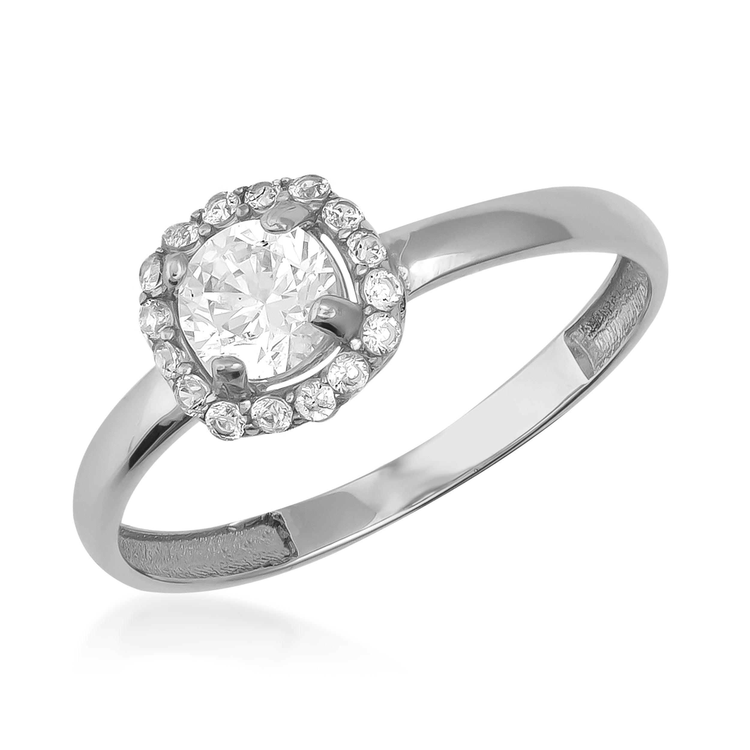White gold ring with round center diamond and pavé diamond halo setting