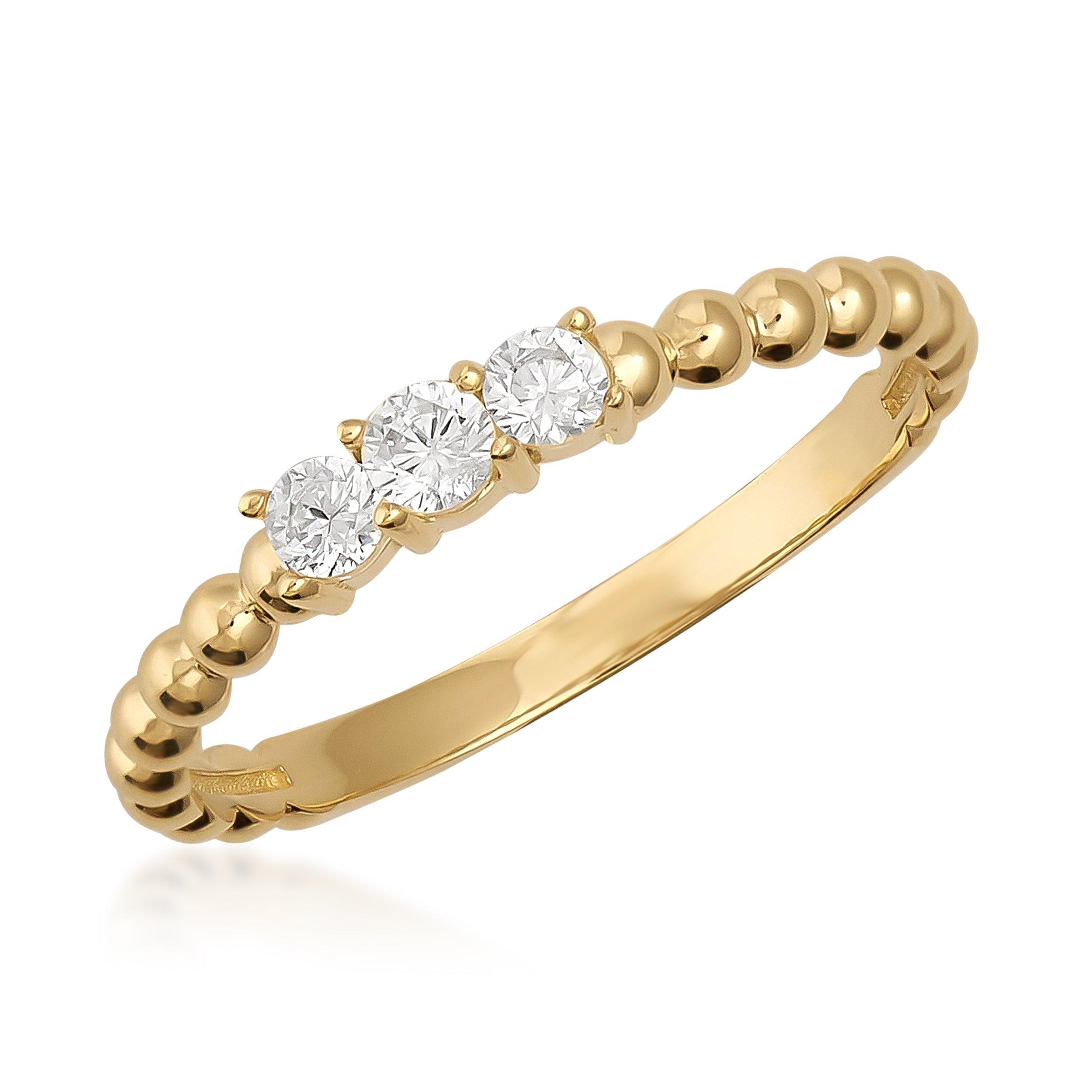 Gold beaded band ring with three round white gemstones, elegant minimalist jewelry