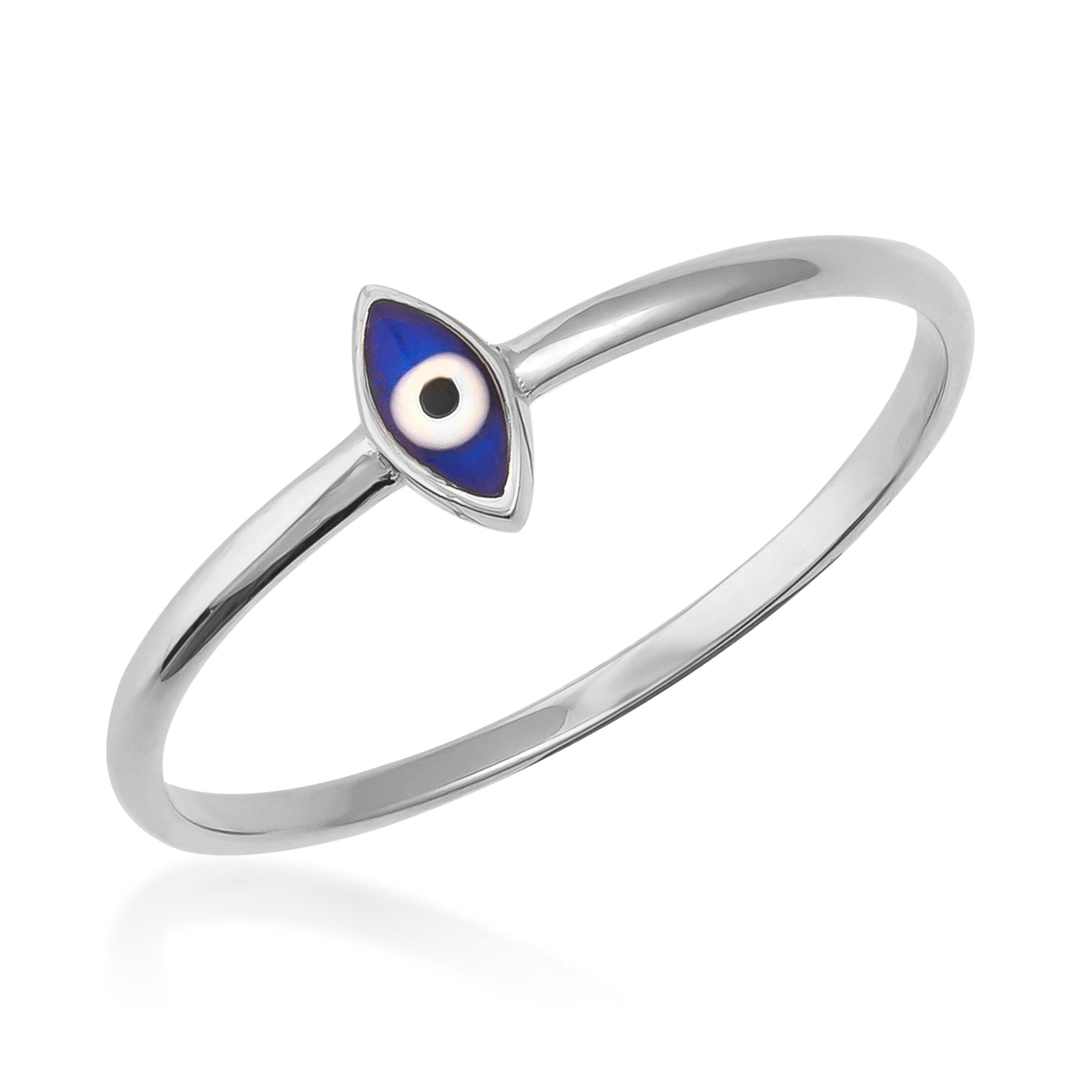 White gold ring with a blue enamel evil eye charm, minimalist jewelry on white background