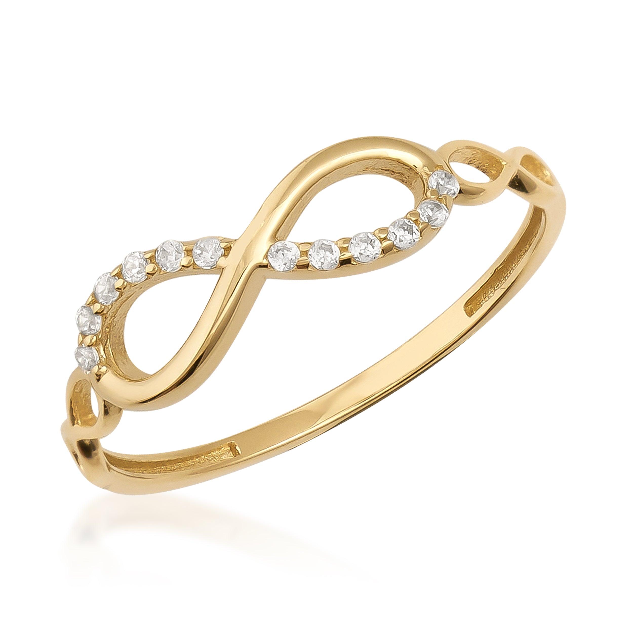 Gold infinity ring with diamond accents on white background