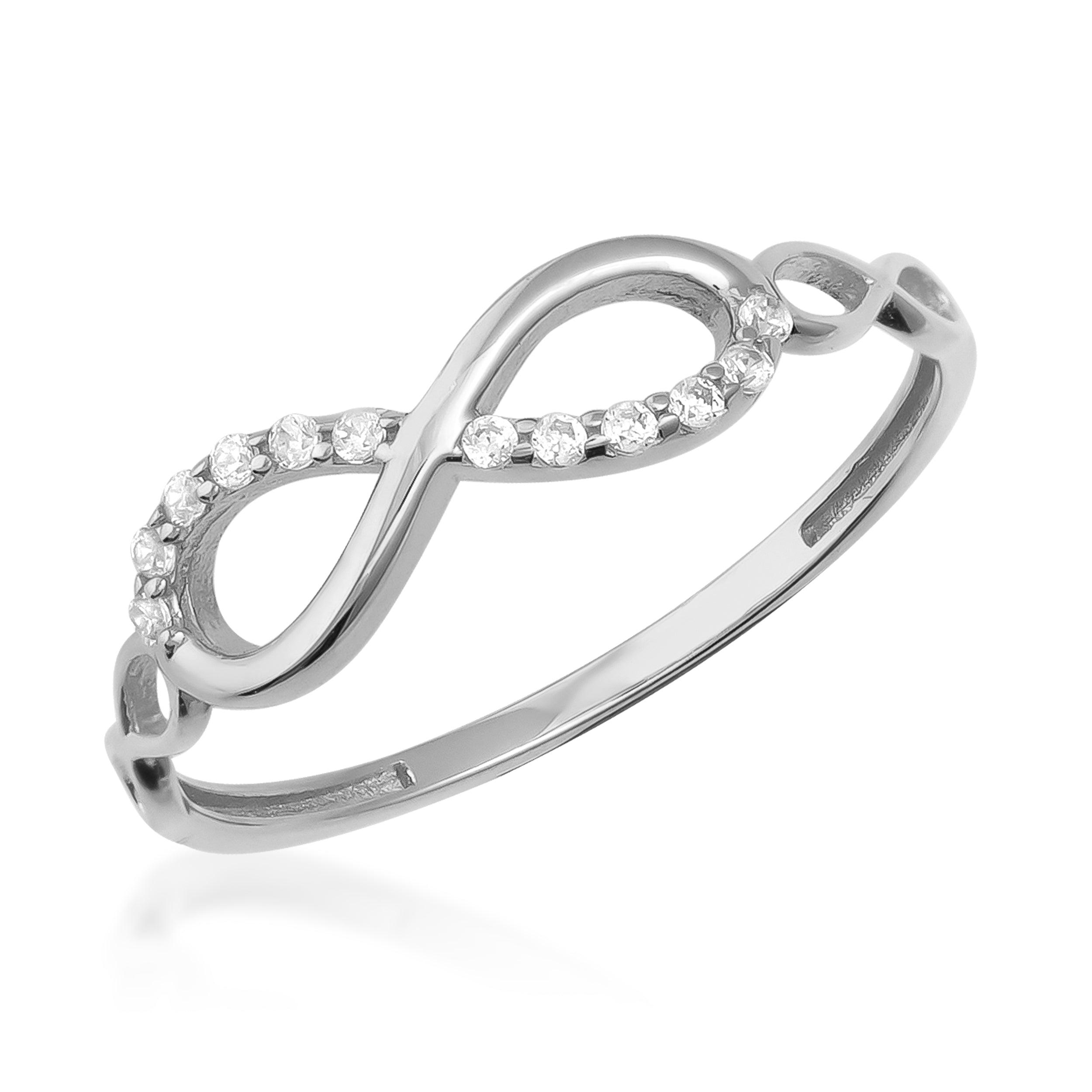 Gold infinity ring with sparkling diamonds on a white background