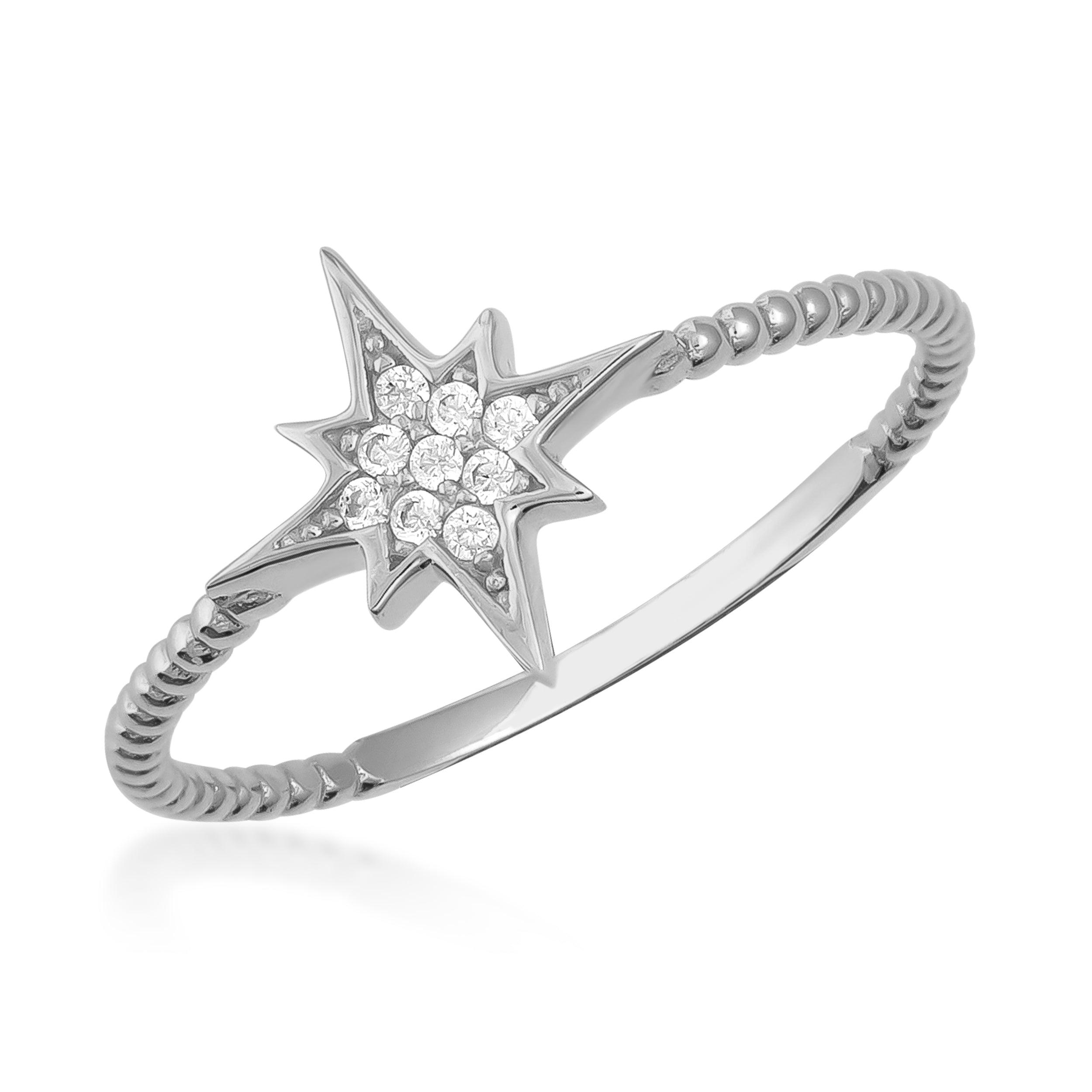 White gold starburst ring with pavé diamonds and twisted band on white background